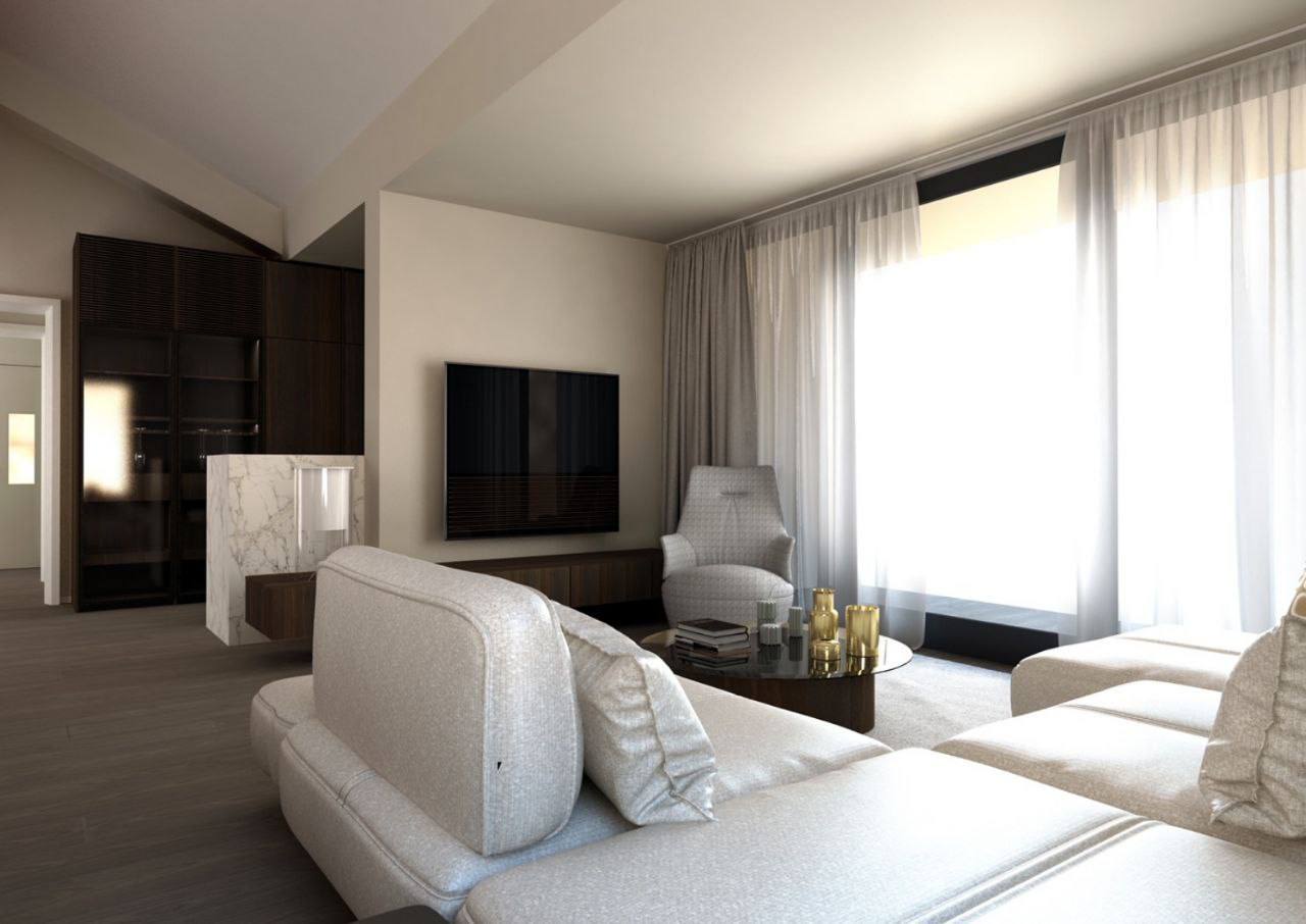 Modern living room in a penthouse in Budva, Montenegro: light-colored sofa, marble finishes, and panoramic windows.