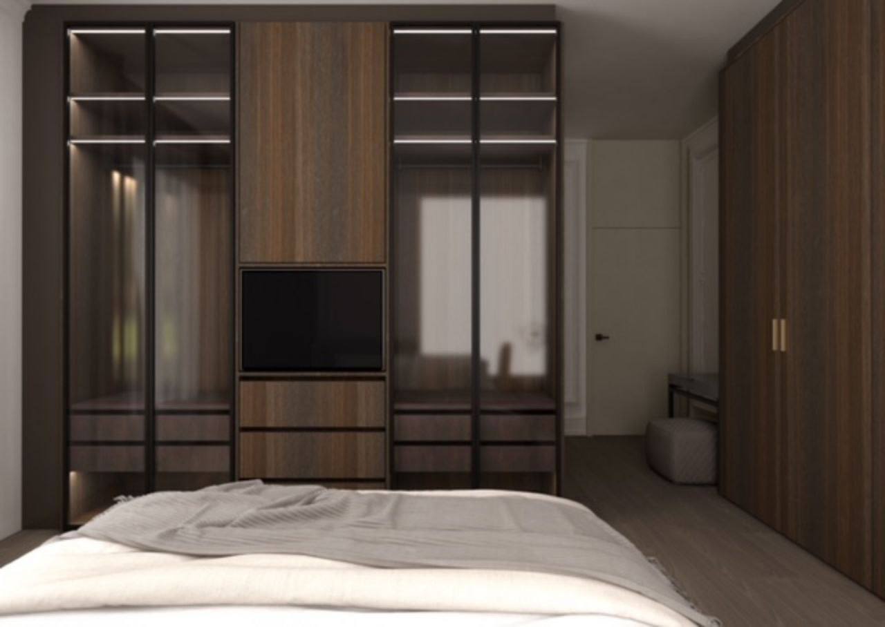 Modern bedroom in a penthouse in Budva, Montenegro: built-in wardrobe with integrated lighting and TV area, premium finishes.