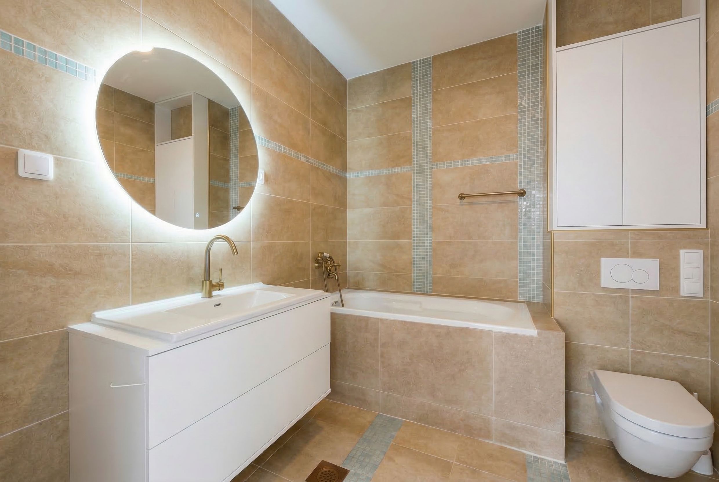 Modern bathroom with white furniture and mirror lighting in an apartment, Budva, Montenegro.