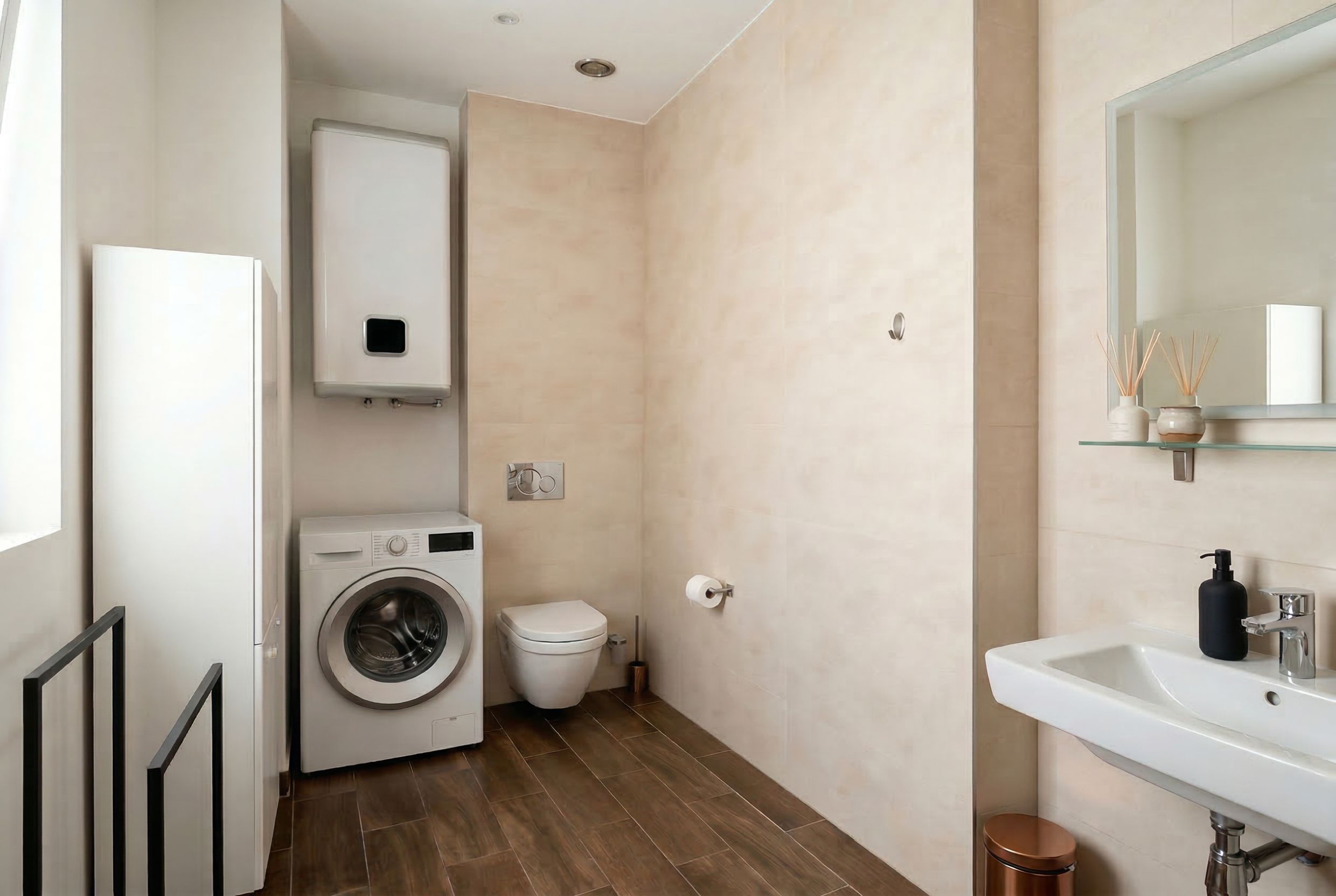 Modern bathroom in an apartment in Budva, Montenegro: stylish finishes, wall-mounted toilet, washing machine.