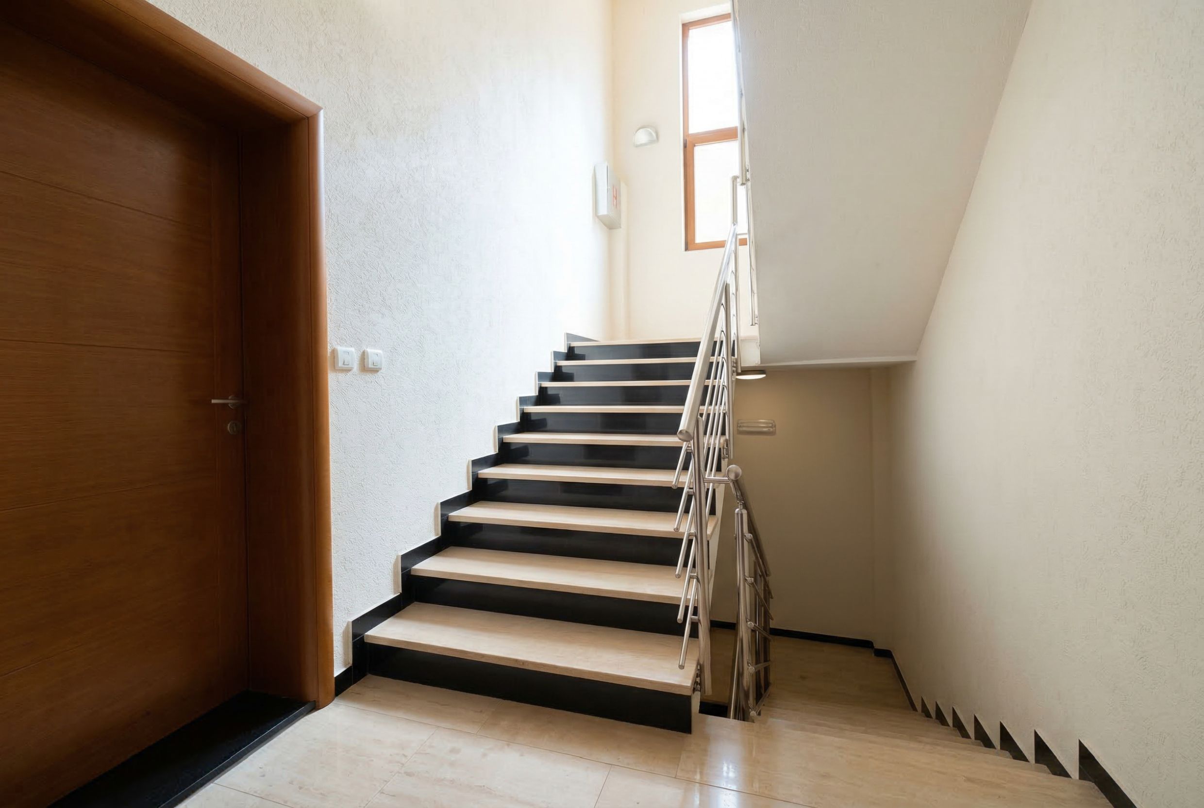 Staircase with mixed steps and metal railings in a penthouse, Kamenovo, Montenegro.
