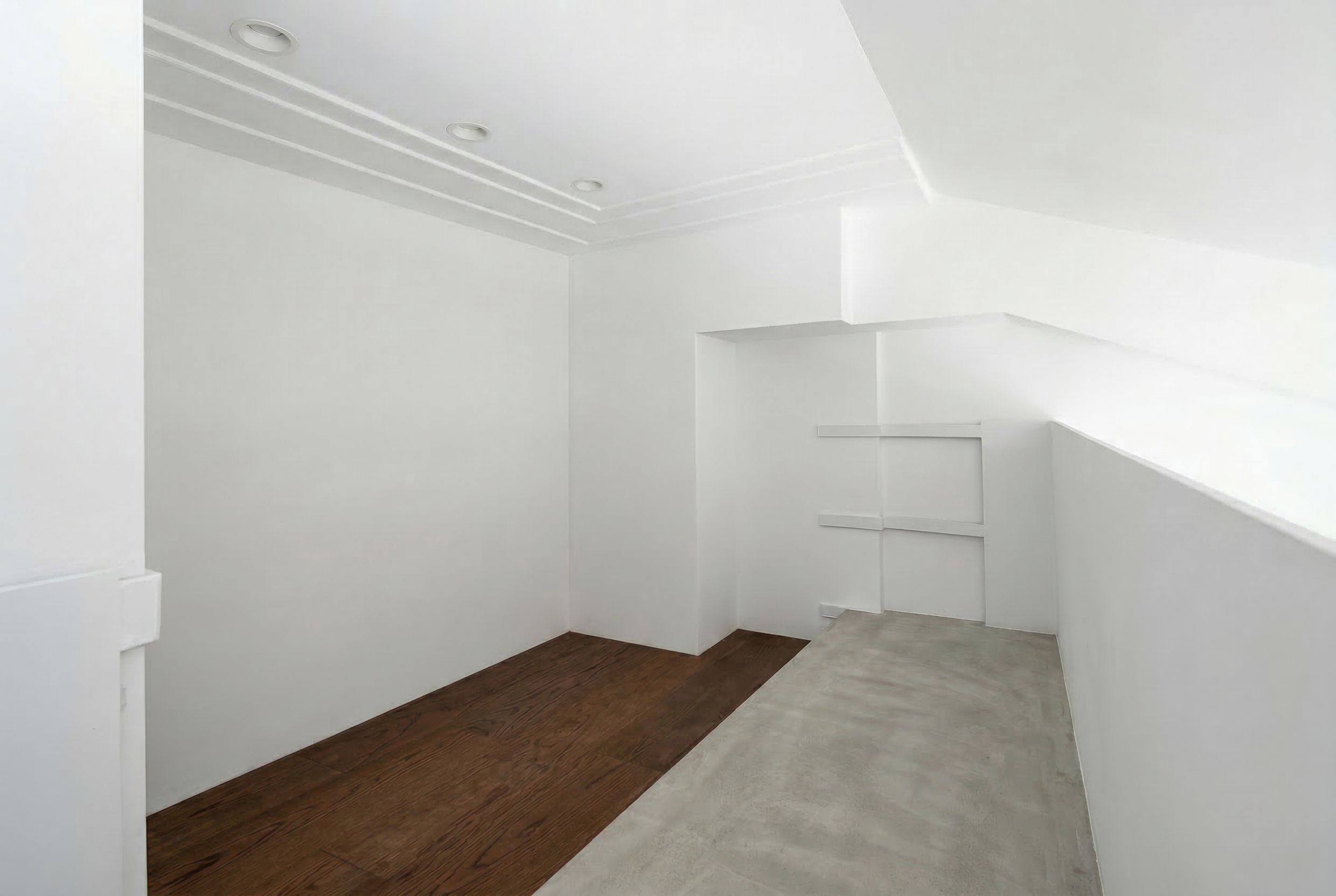 Bright penthouse room in Budva, Montenegro: white walls, combined wood and concrete flooring, recessed lighting.