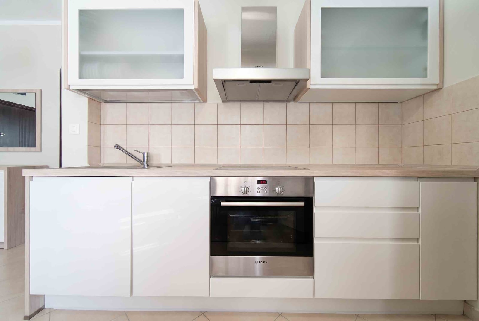 Modern bright kitchen with Bosch appliances in an apartment for sale in Bečići, Montenegro.