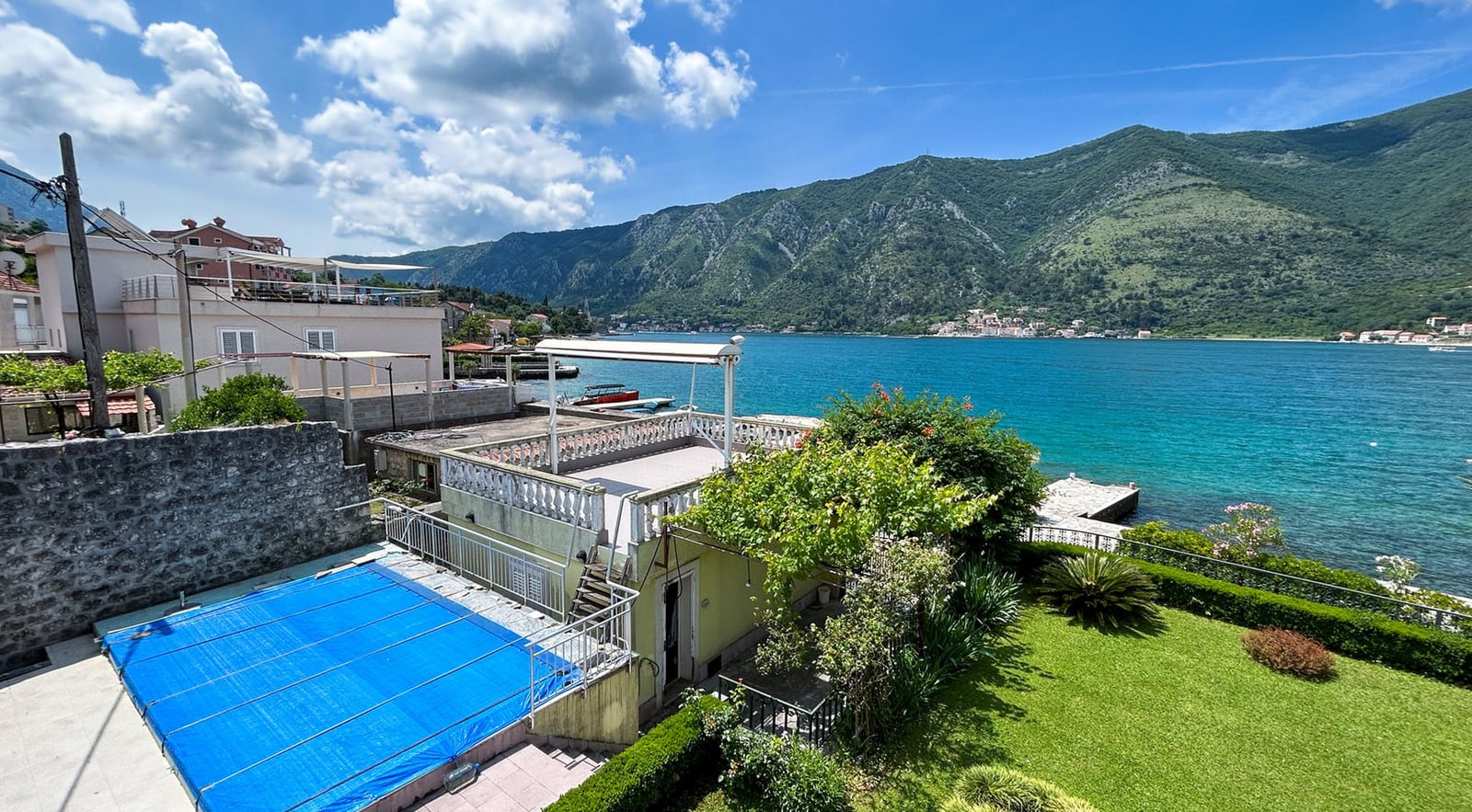 Villa in Dobrota, Montenegro: sea view, private pool, terrace, and a well-kept garden on the waterfront of the Bay of Kotor.