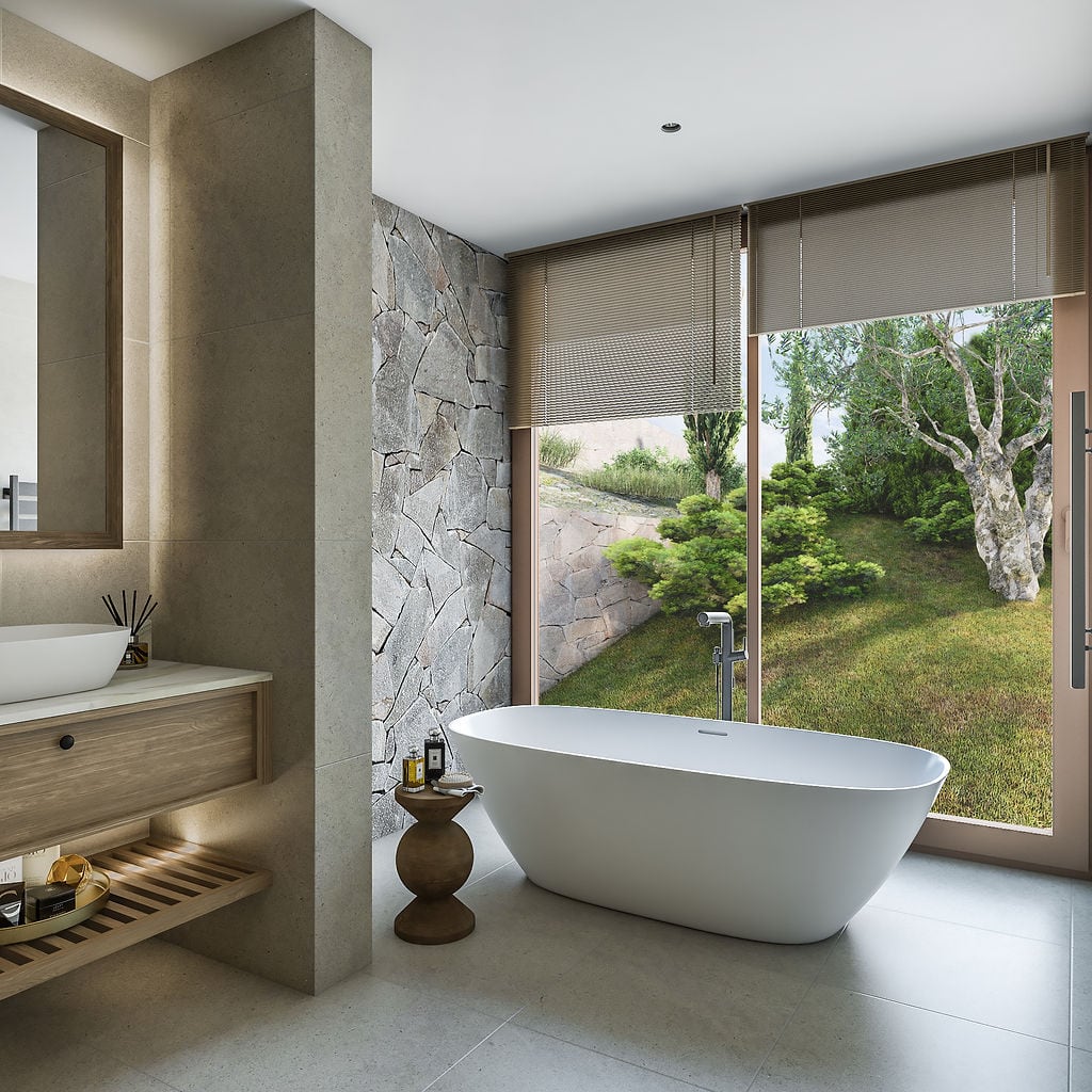 Modern bathroom with a freestanding bathtub and garden view in a luxury villa, Luštica, Montenegro.