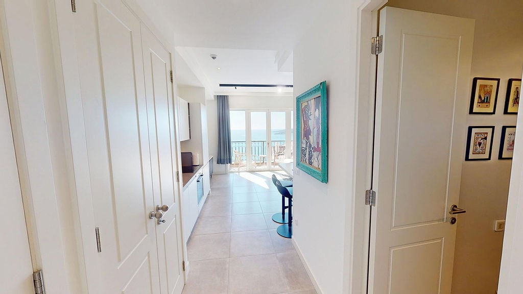Bright kitchen in an apartment in Luštica, Montenegro, with access to a terrace and panoramic sea views.