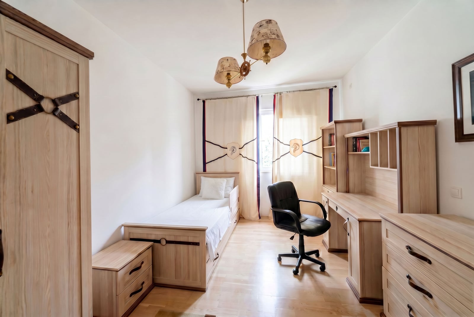 Cozy bedroom with wooden furniture, a bed, and a desk in an apartment for sale, Kumbor, Montenegro.