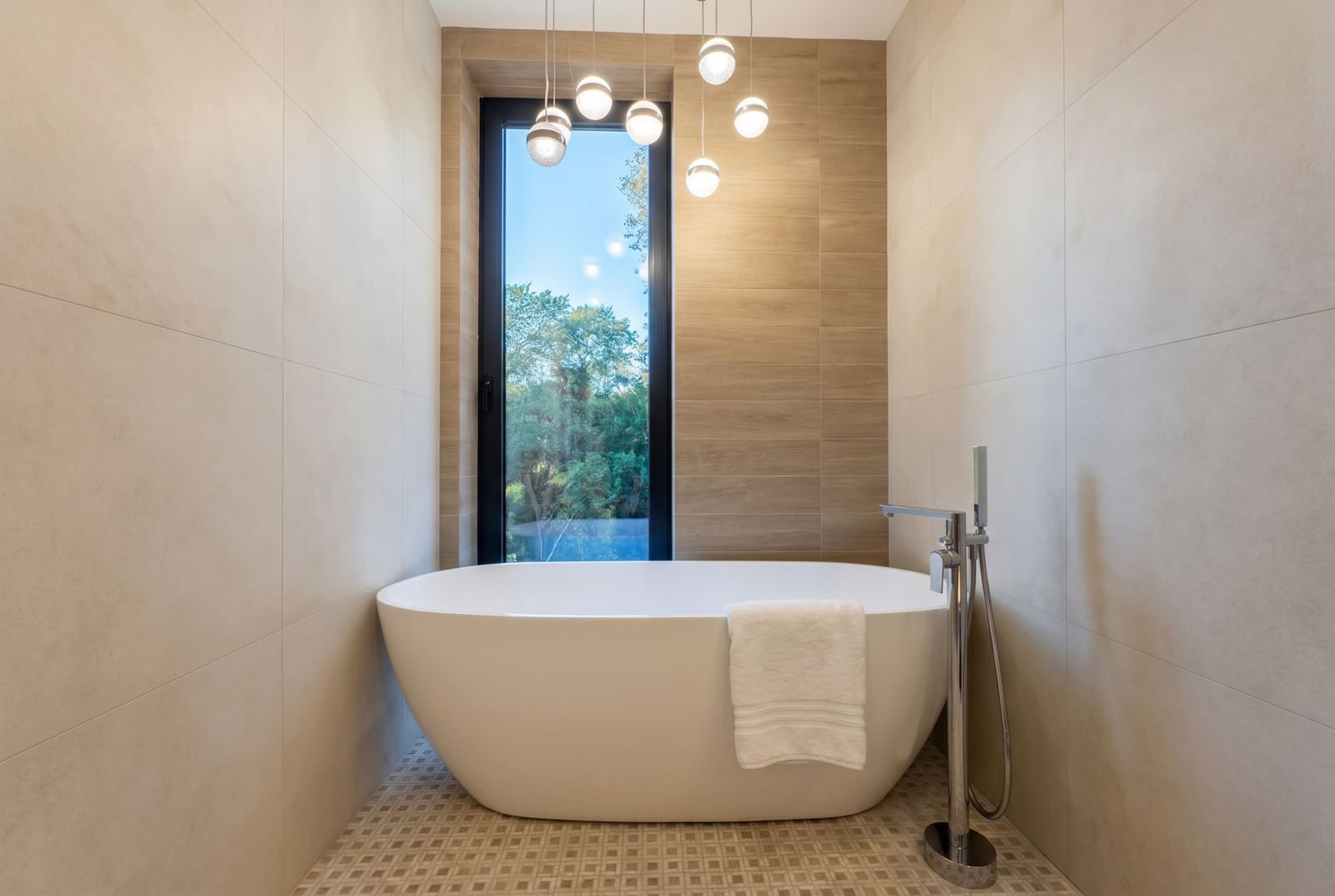 Modern bathroom with a freestanding bathtub and panoramic window in a luxury villa, Kavac, Montenegro.