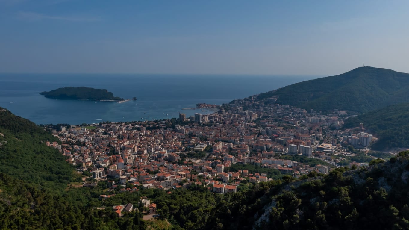 Panoramic view of Budva and St. Nicholas Island in Montenegro, bird's-eye view of the sea and mountains.