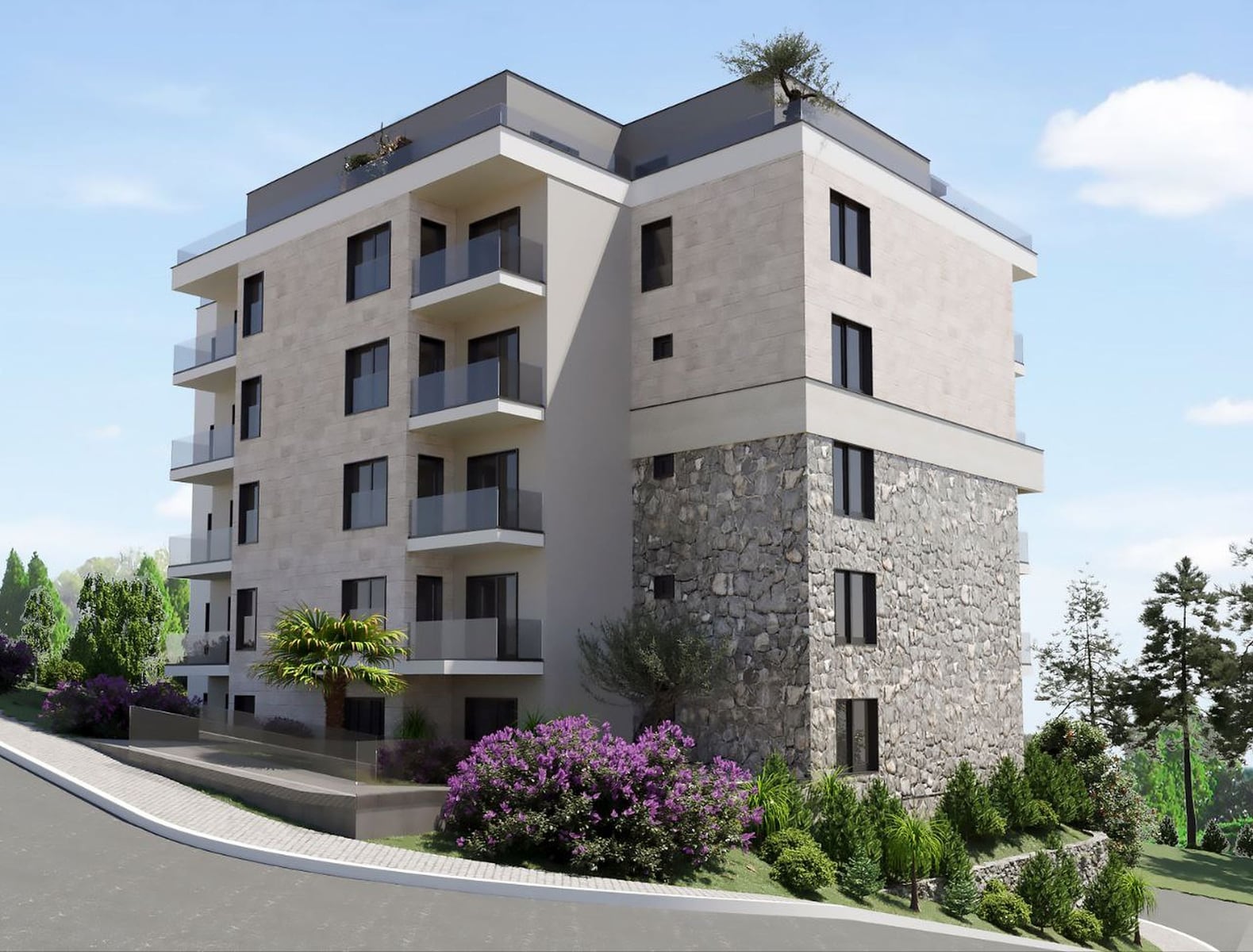 Modern residential complex in Budva, Montenegro: stone facade, panoramic balconies, and landscaped grounds.