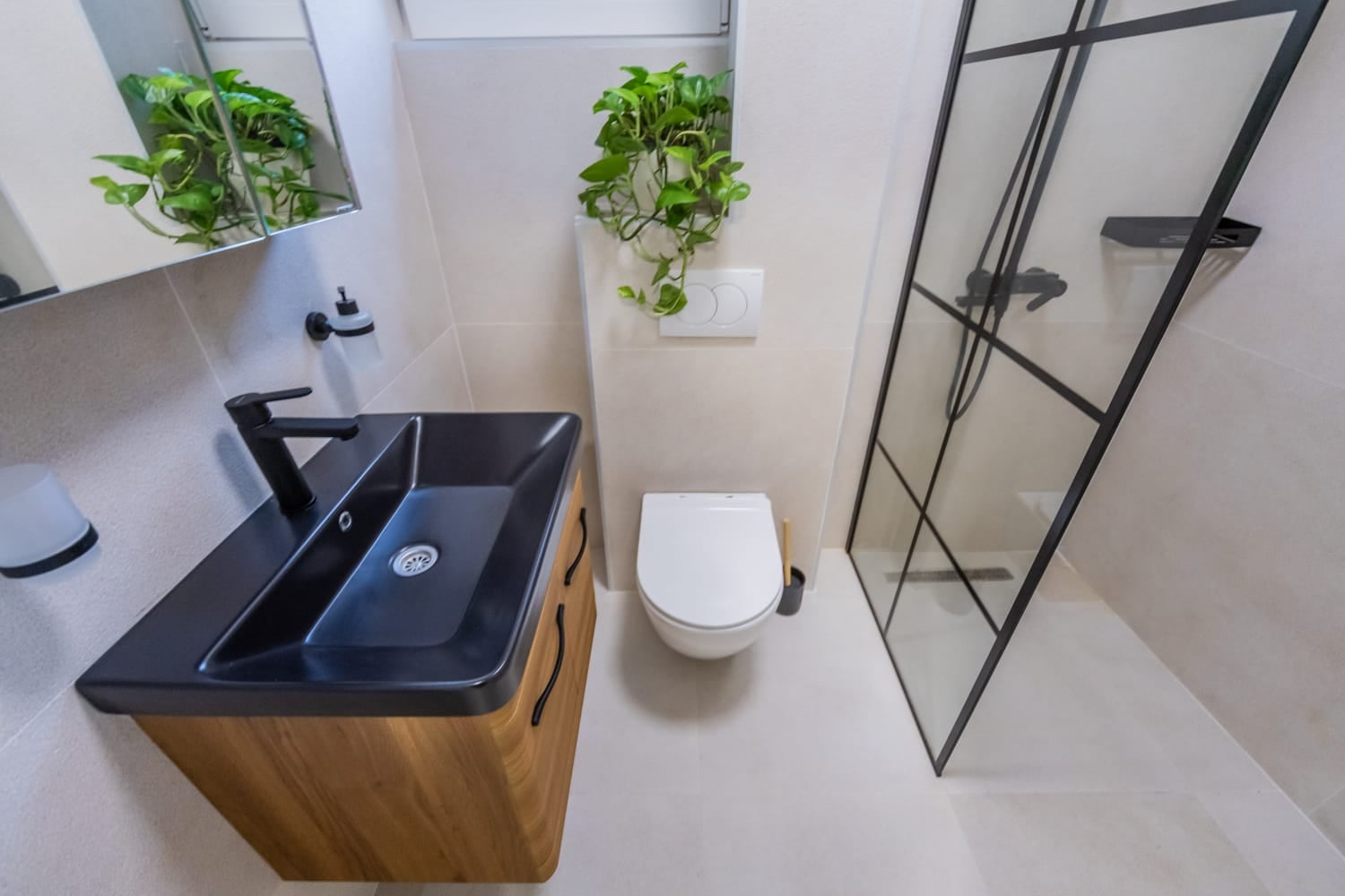 Modern bathroom with a shower cabin and black fixtures at a villa in Budva, Montenegro.