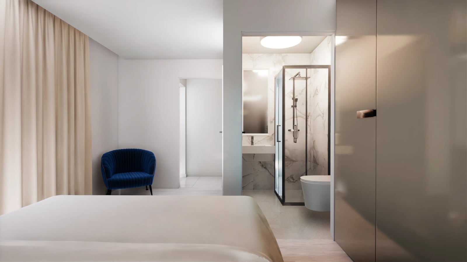 Modern bedroom with a blue armchair and a marble-finished bathroom, townhouse in Reževići, Montenegro.