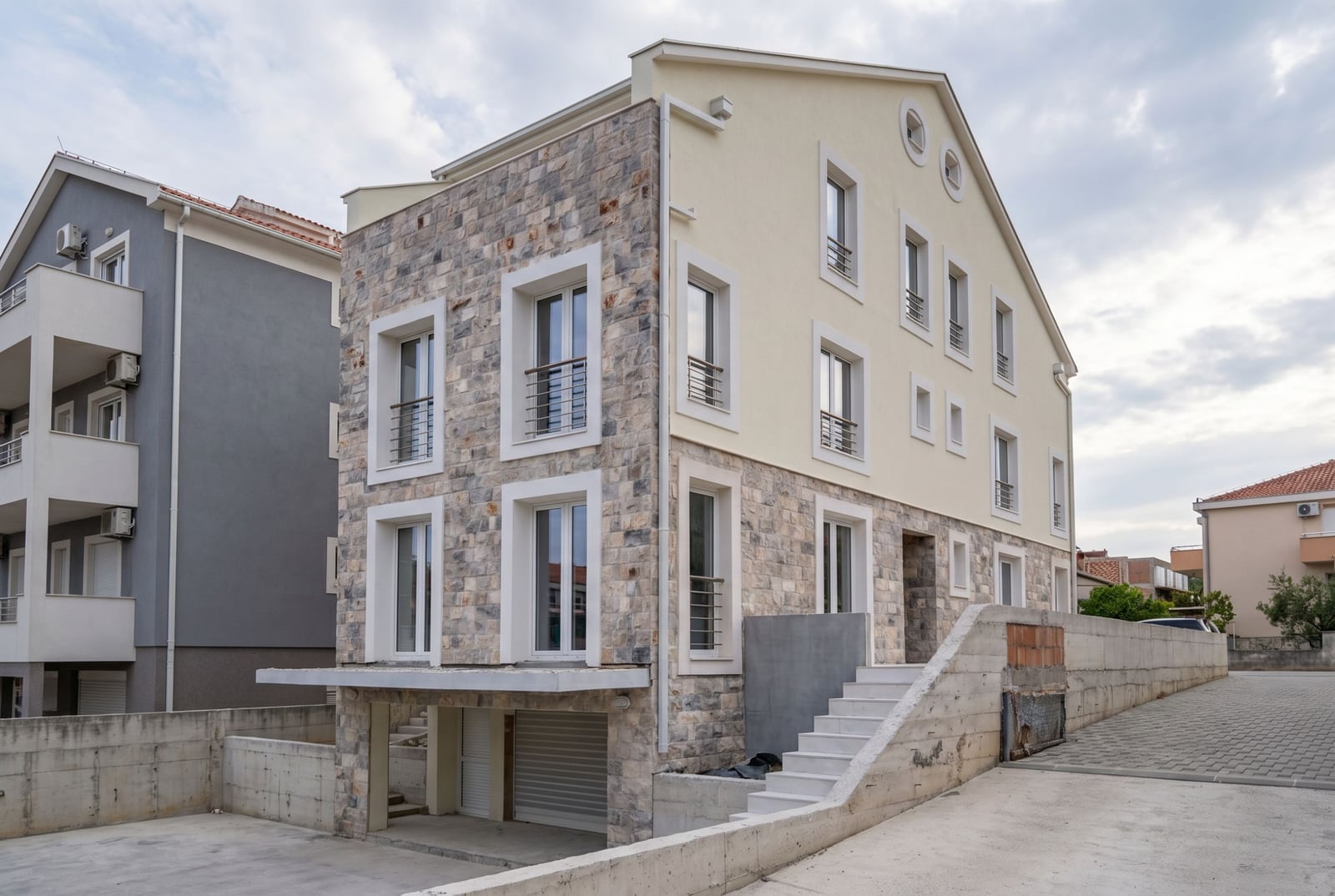 Modern three-story house with stone cladding and a garage in Đenovići, Herceg Novi, Montenegro.