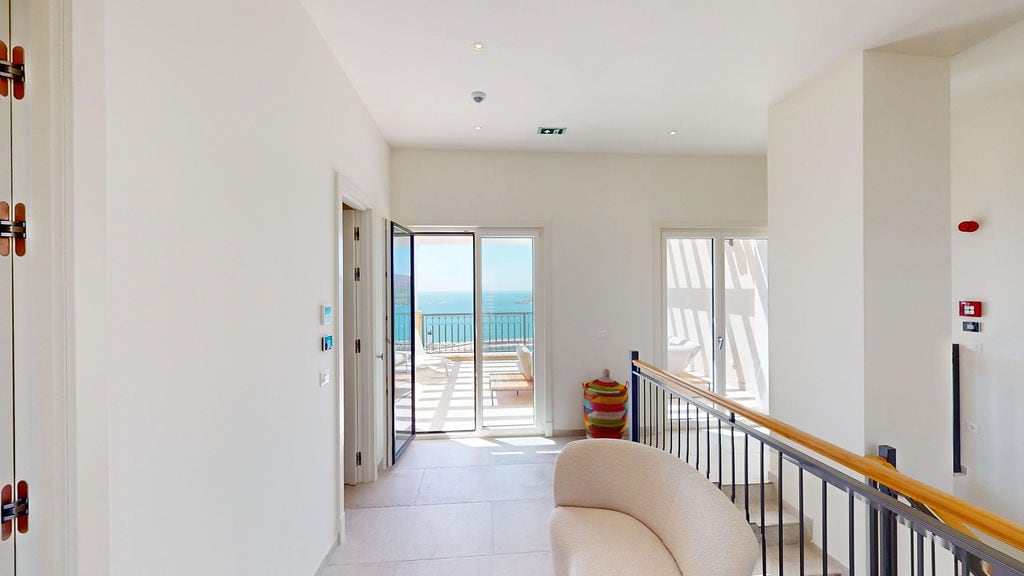 Bright living room in a villa in Luštica, Montenegro, with access to a terrace and panoramic views of the Adriatic Sea.