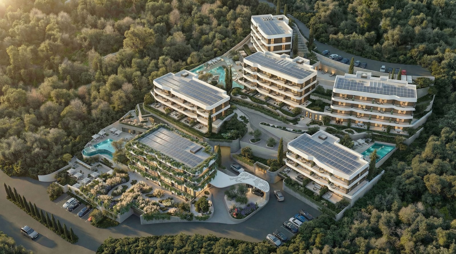 Aerial view of a modern residential complex with pools and solar panels nestled in a forest.