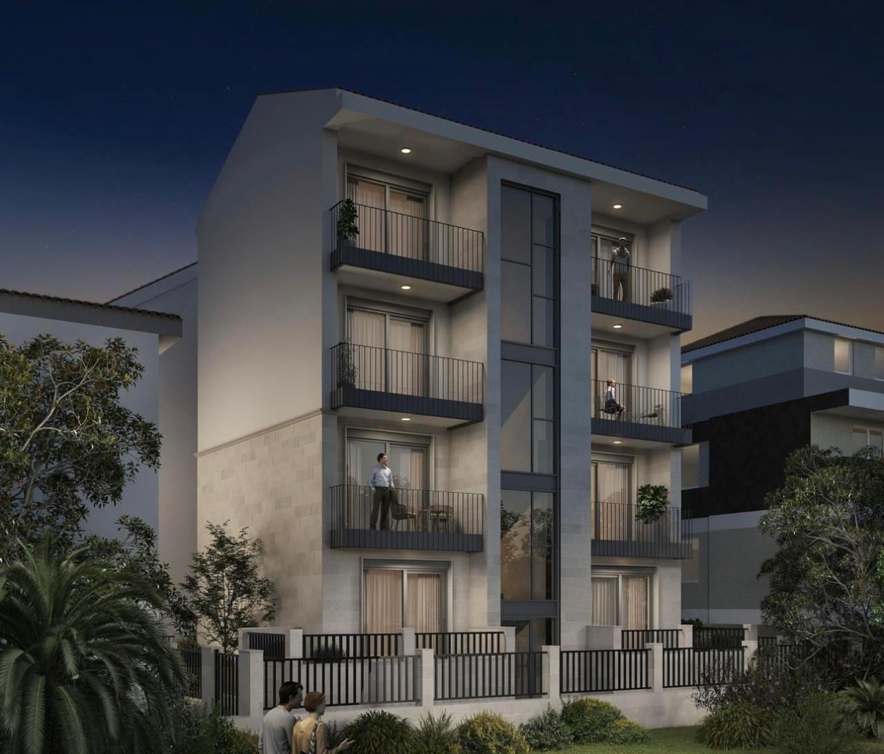 Modern residential complex in Herceg Novi, Montenegro: a four-story building with balconies and panoramic glazing.