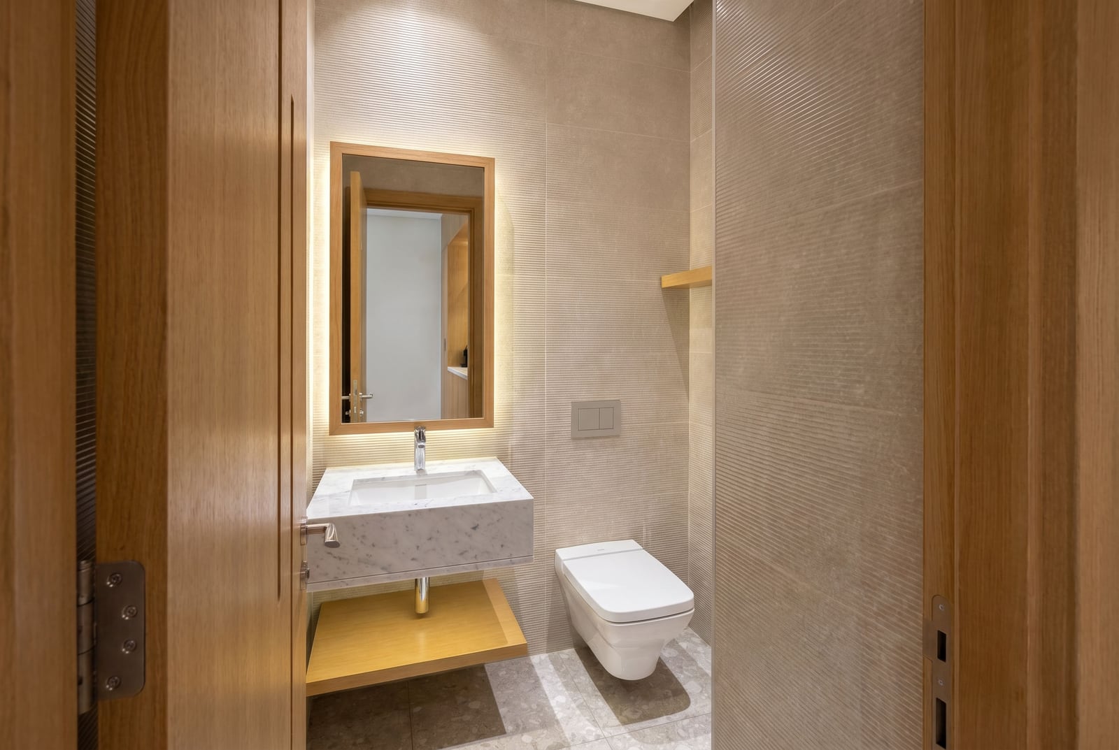 Modern bathroom with a marble sink in a Lustica Bay apartment, Montenegro: stylish interior and decor.