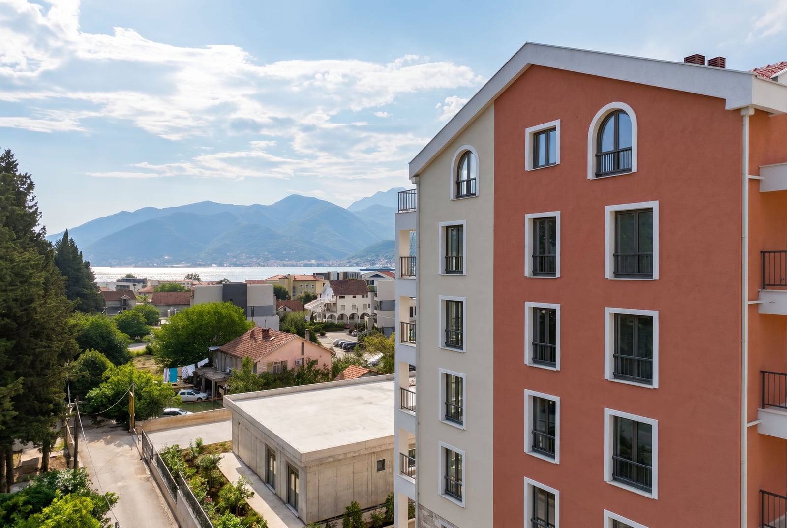 Modern residential building in Tivat, Montenegro, with panoramic views of the mountains and the Adriatic Sea.
