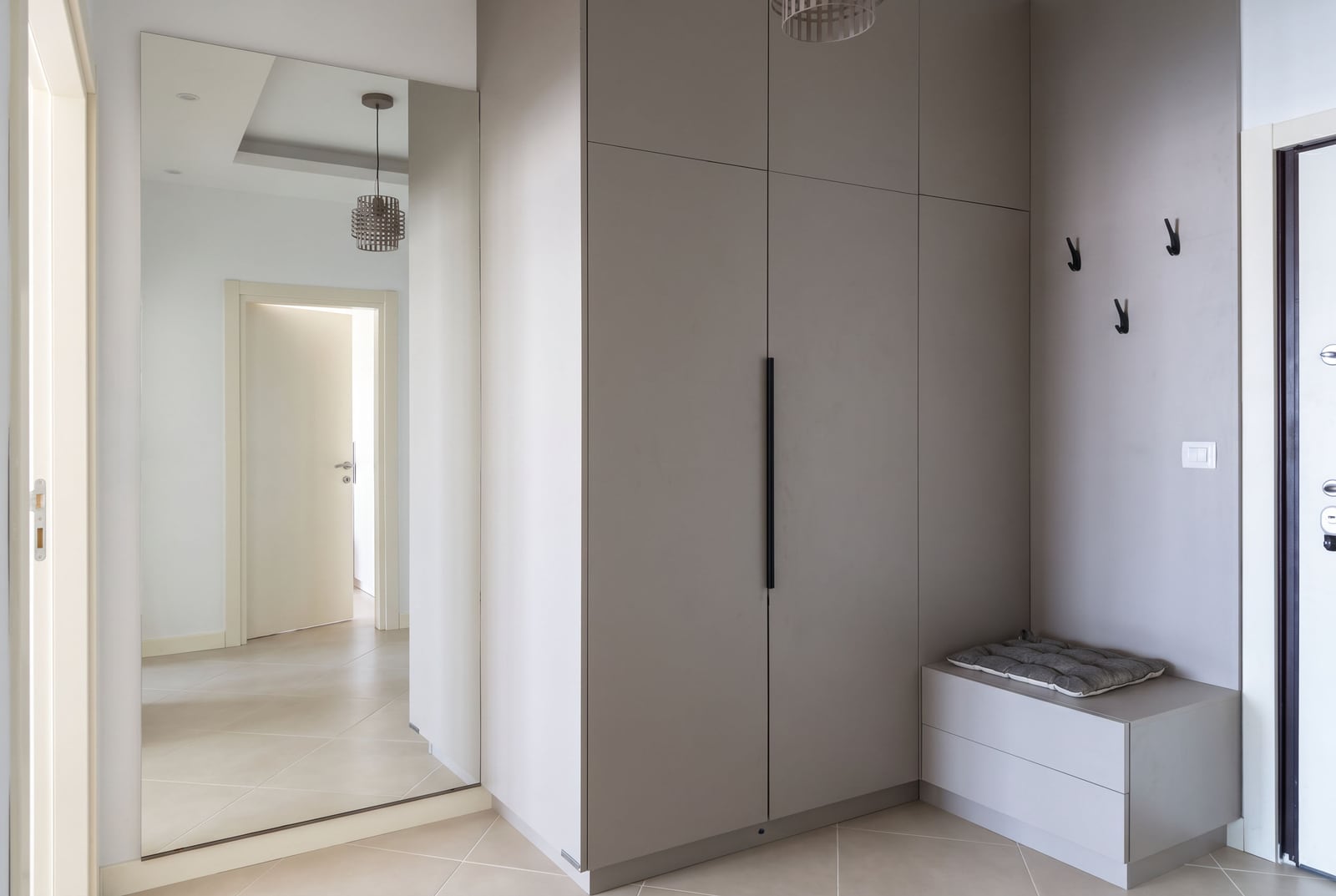 Modern hallway with built-in wardrobe and mirror in an apartment, Dobrota, Montenegro.