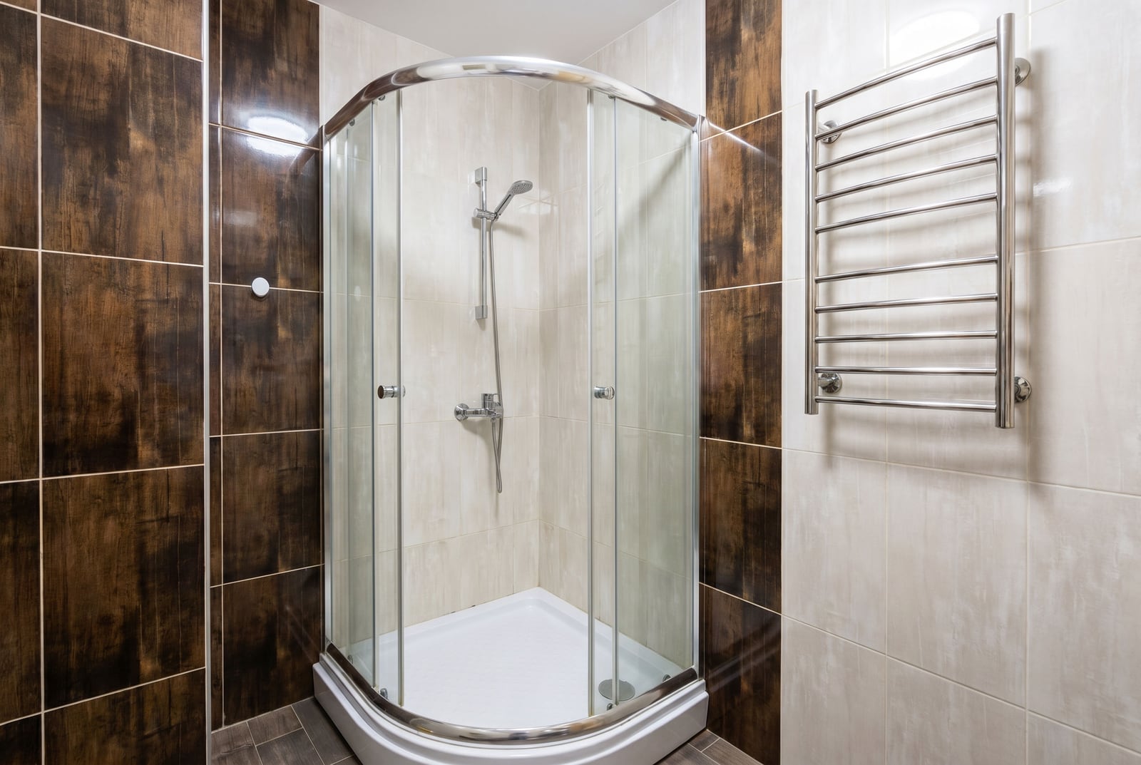 Modern bathroom with a walk-in shower and a heated towel rail in an apartment, Becici, Montenegro.
