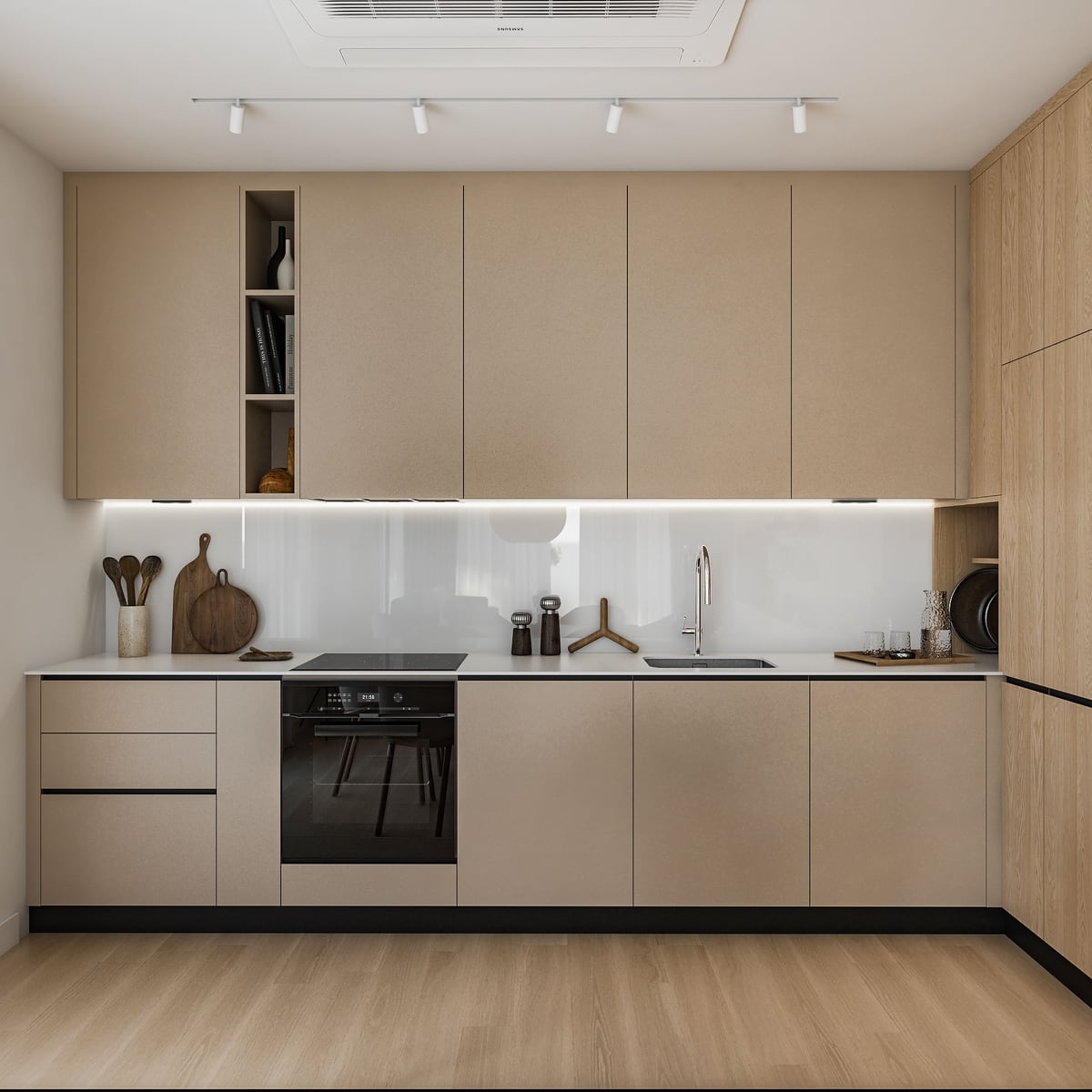 Modern kitchen featuring beige cabinets, a built-in oven, sink, and wooden accessories on the countertop.