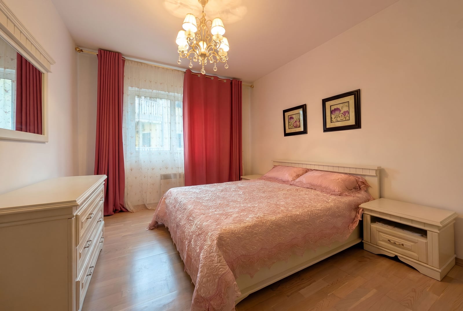 Cozy bedroom with a double bed and light-colored furniture in an apartment in Kumbor, Montenegro.