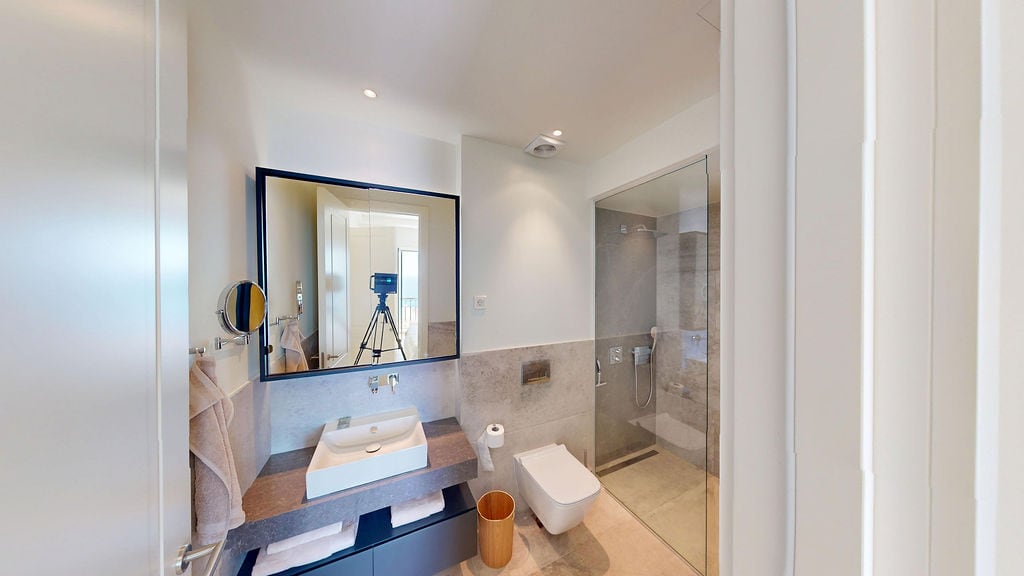 Modern bathroom with a shower cabin and stylish finishes in a residential complex, Luštica, Montenegro.