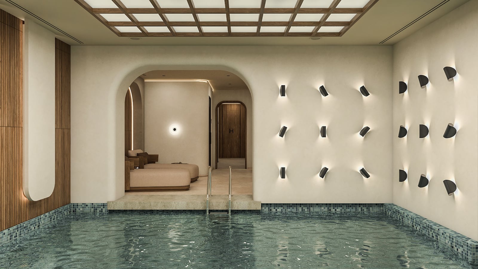 Indoor pool with blue mosaic tiles, metal ladder, and an arched doorway leading to a lounge area.
