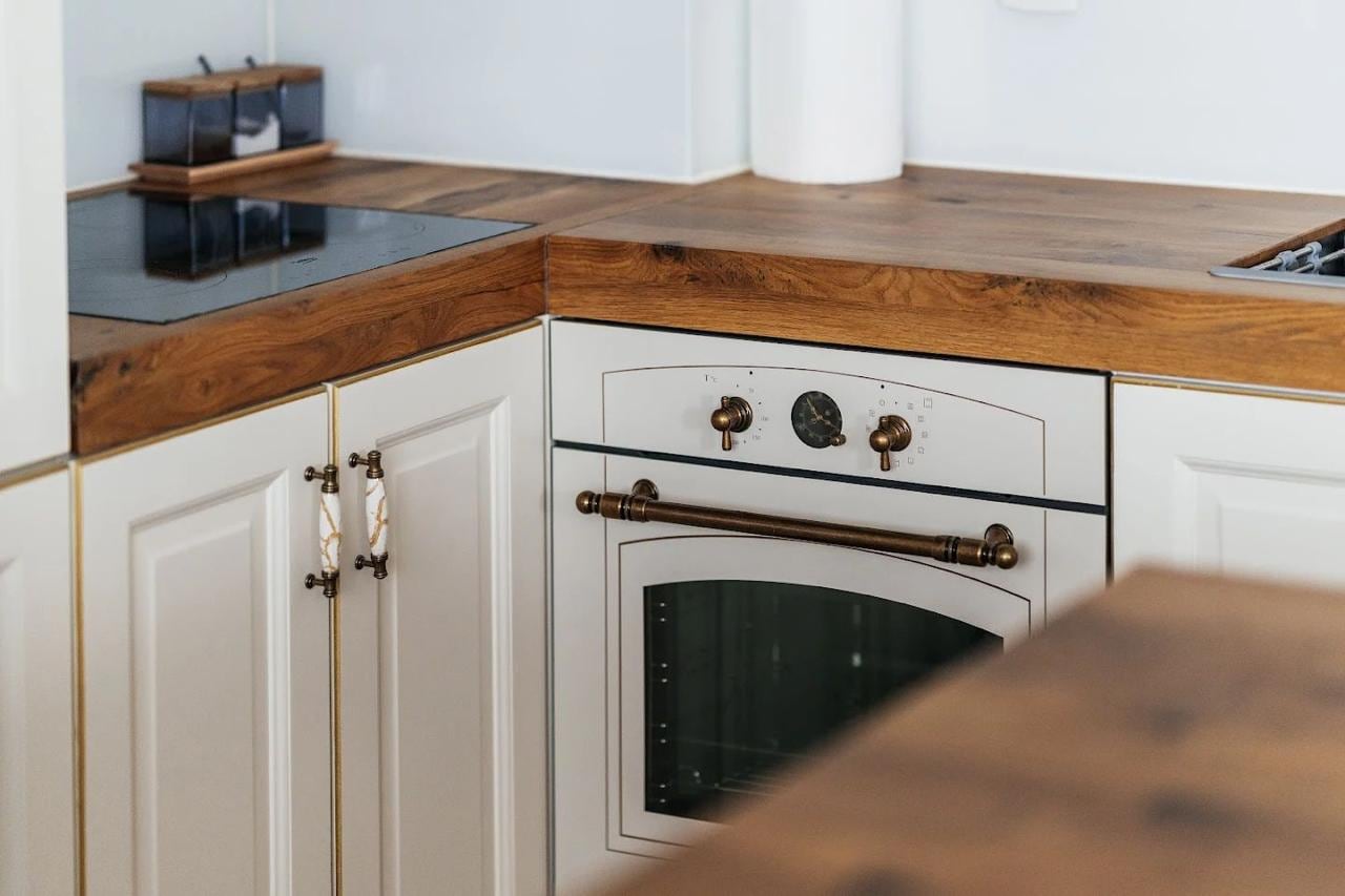 Classic-style kitchen with a wooden countertop and vintage appliances in an apartment, Budva, Montenegro.