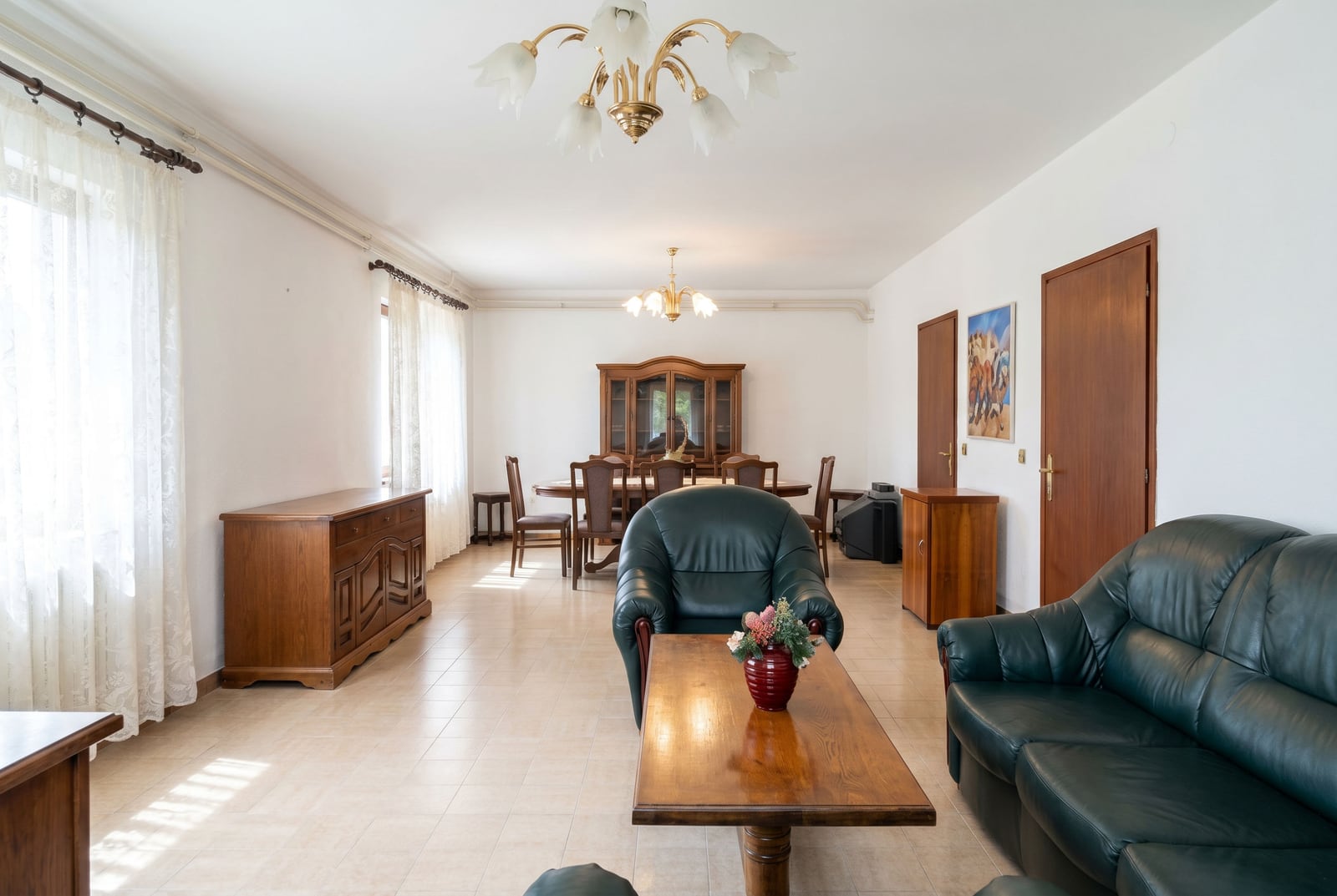 Spacious living room with leather furniture and a dining area in a house, Lastva, Montenegro.