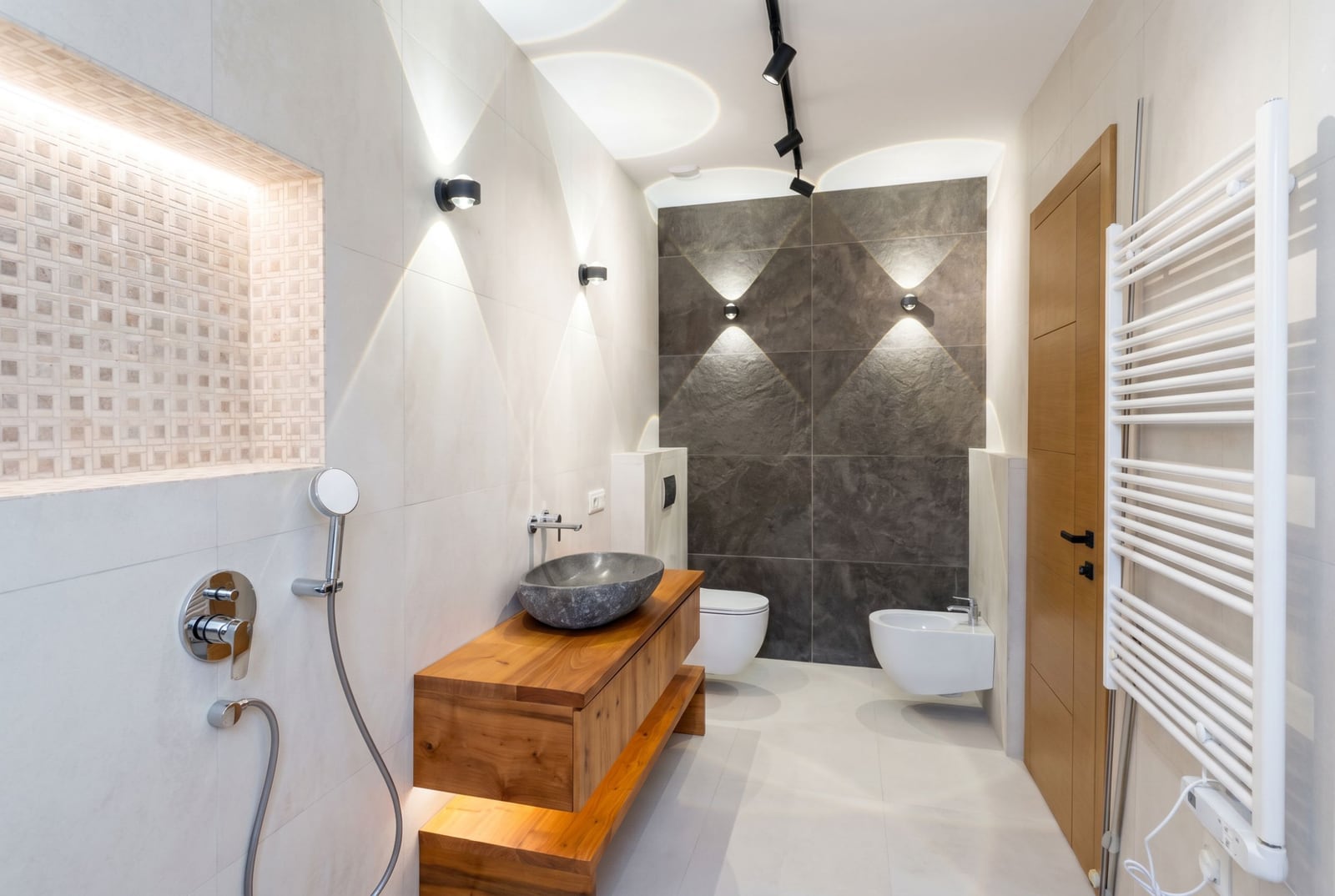 Modern bathroom with a stone sink and wooden vanity in a villa in Kavac, Montenegro.