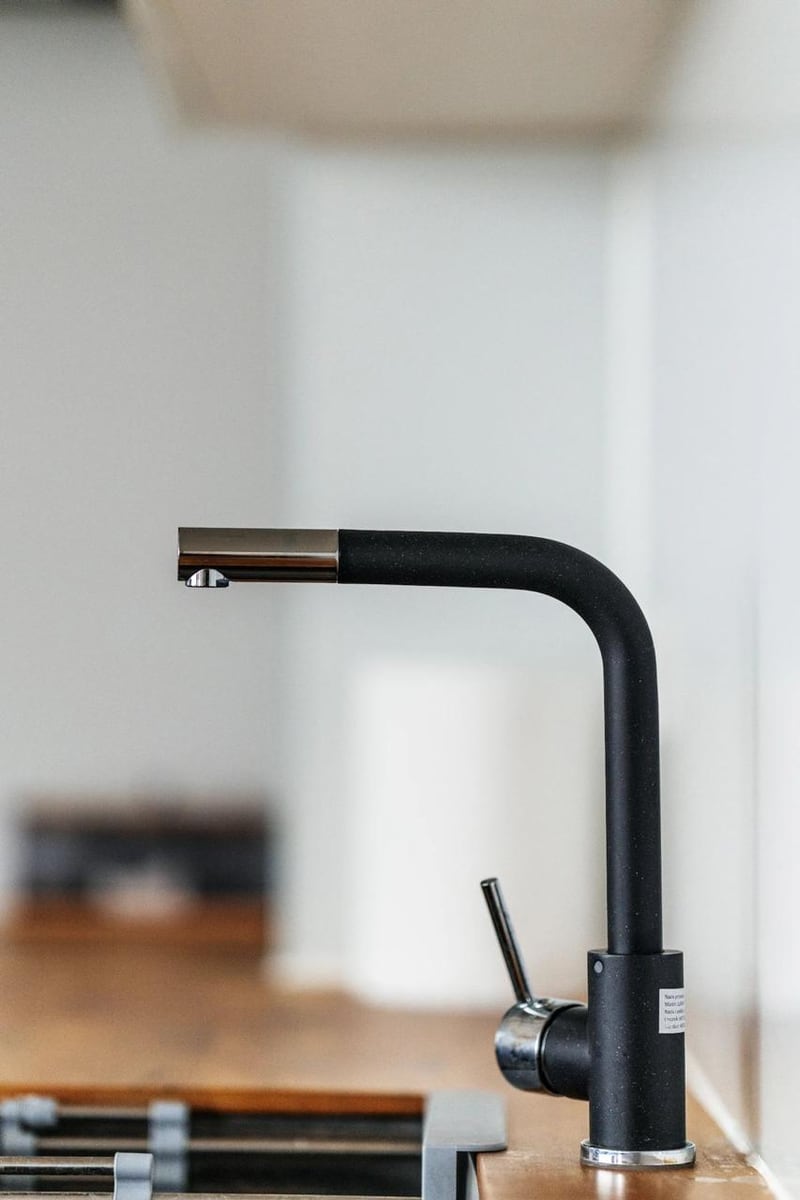 Modern black kitchen faucet in an apartment in Budva, Montenegro. Interior detail of apartment No. 2615.