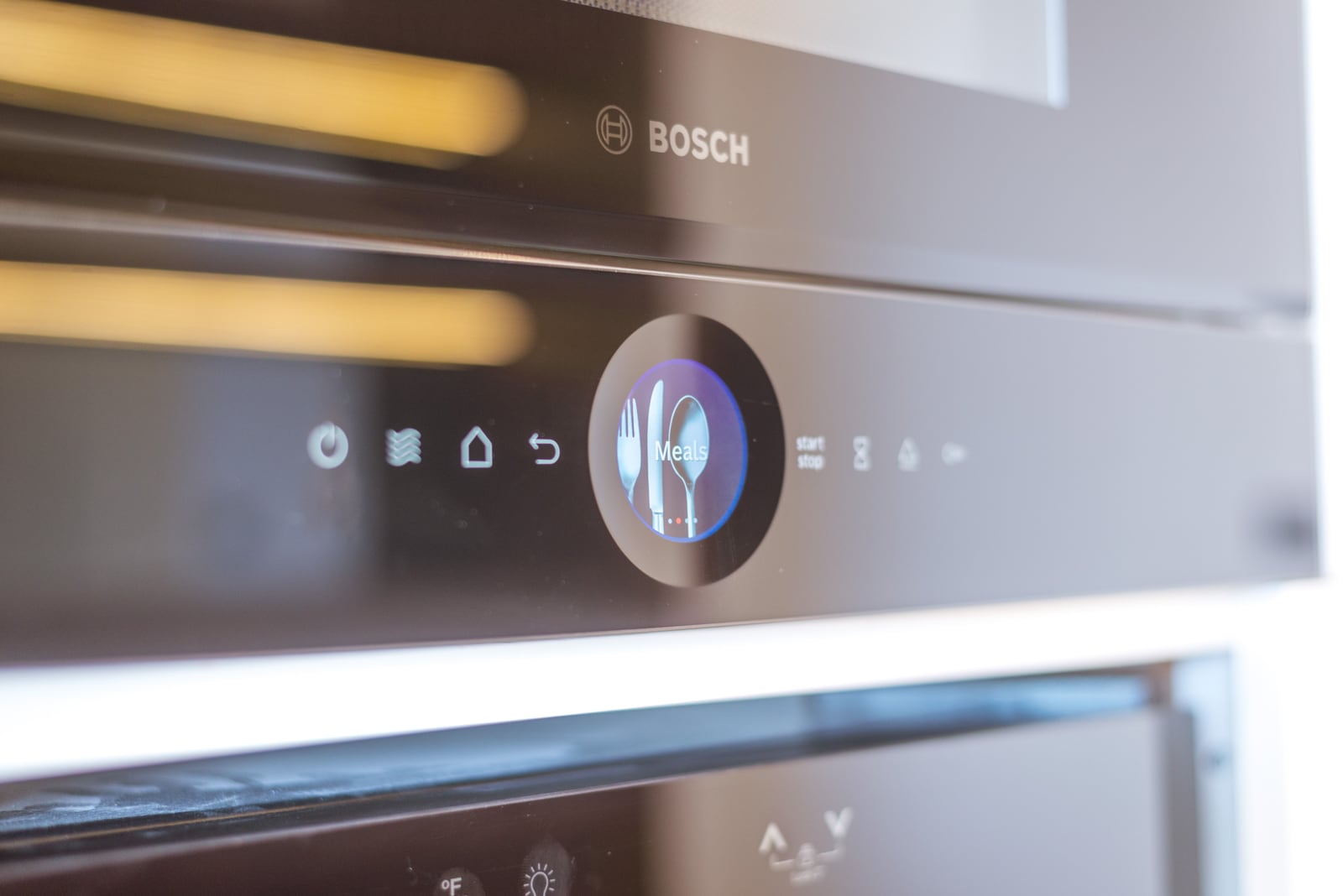 Built-in modern Bosch oven with a touchscreen display in the kitchen of an apartment in Bečići, Montenegro.