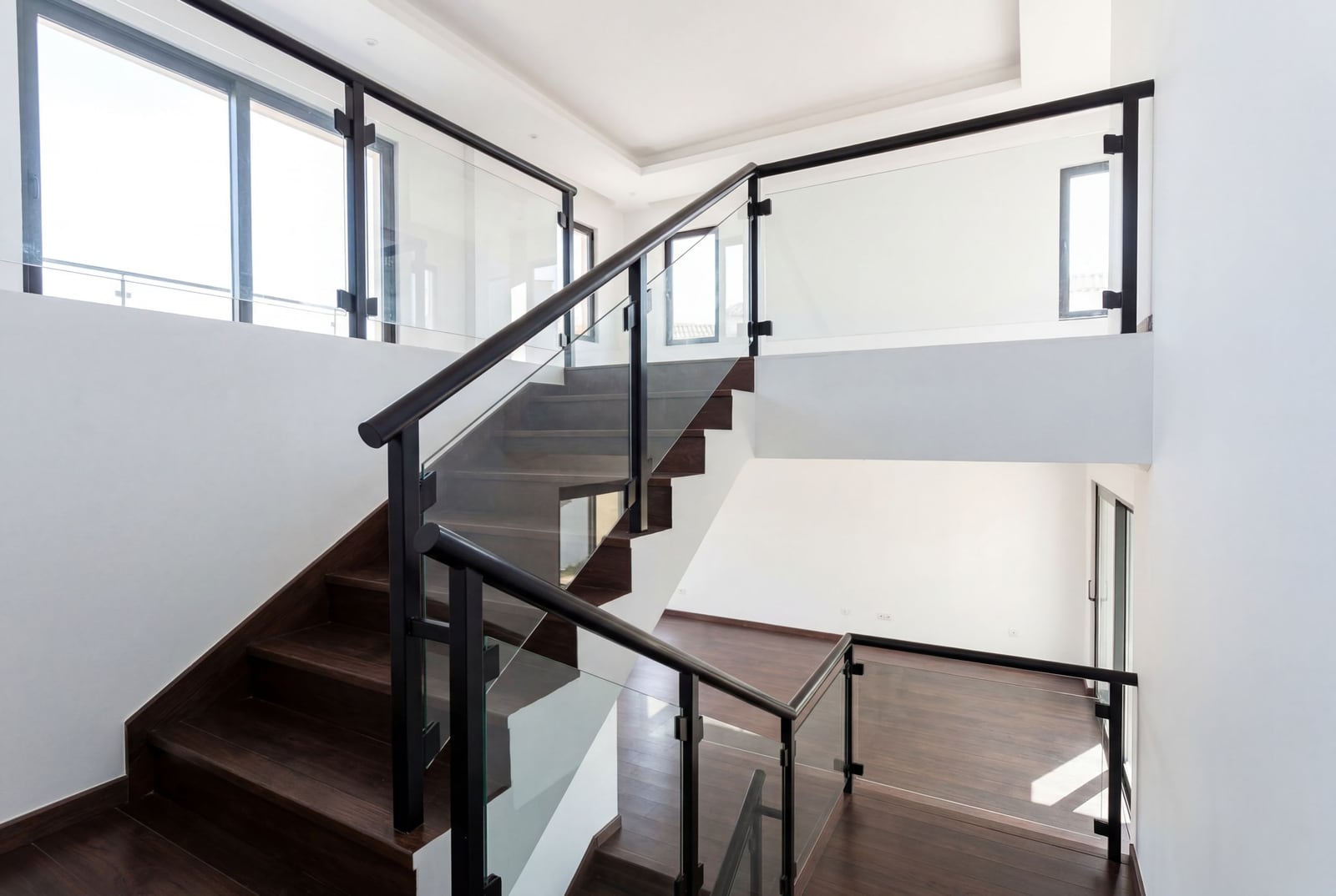 Modern staircase with wooden steps and glass railing in an office, Baošići, Montenegro