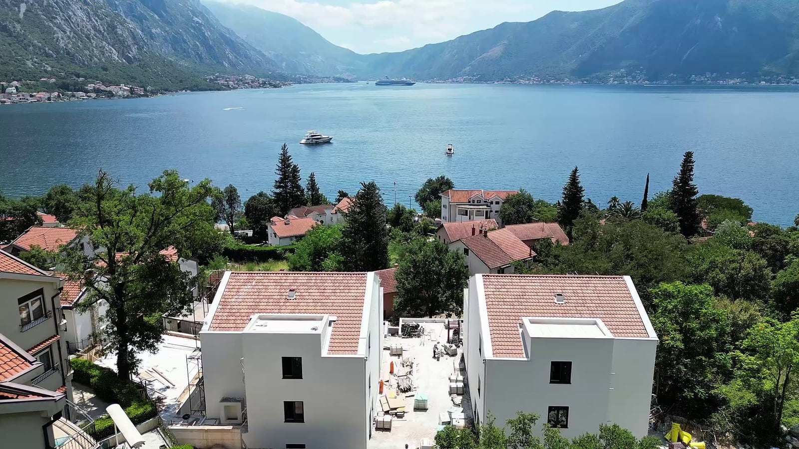 Panoramic view of the Bay of Kotor and mountains from the terrace of a residential complex in Orahovac, Montenegro.