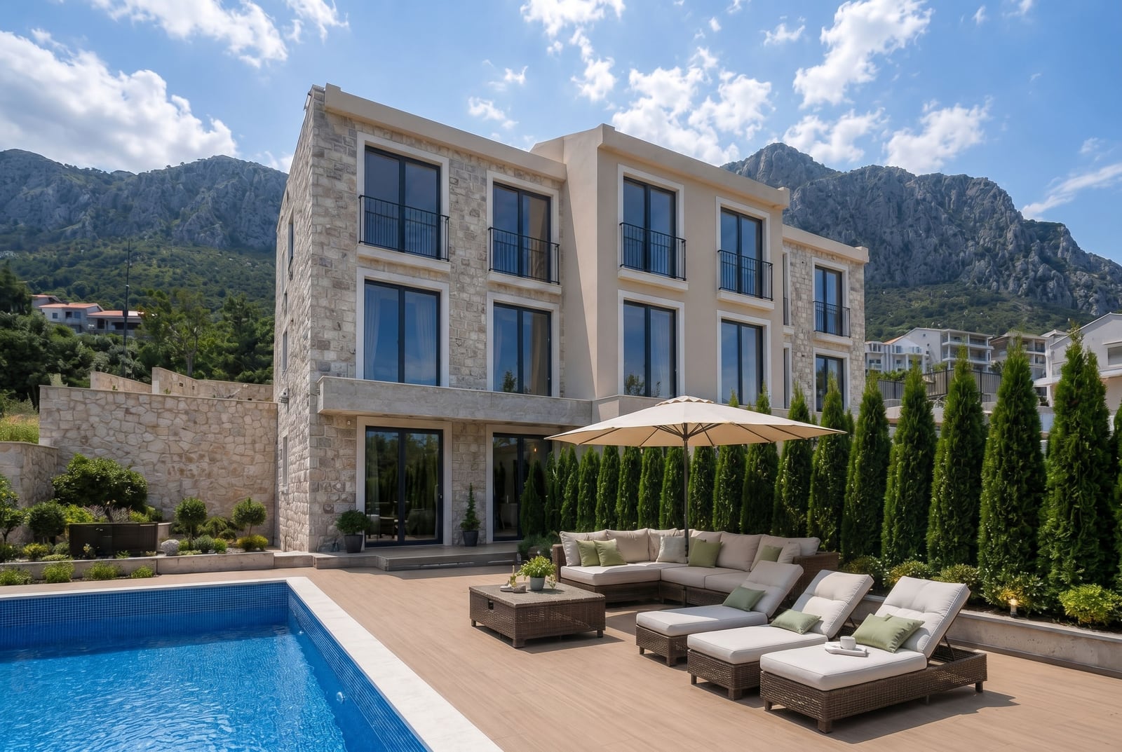 Modern townhouse with a swimming pool, terrace, and mountain views in Blizikuće, Reževići, Montenegro.