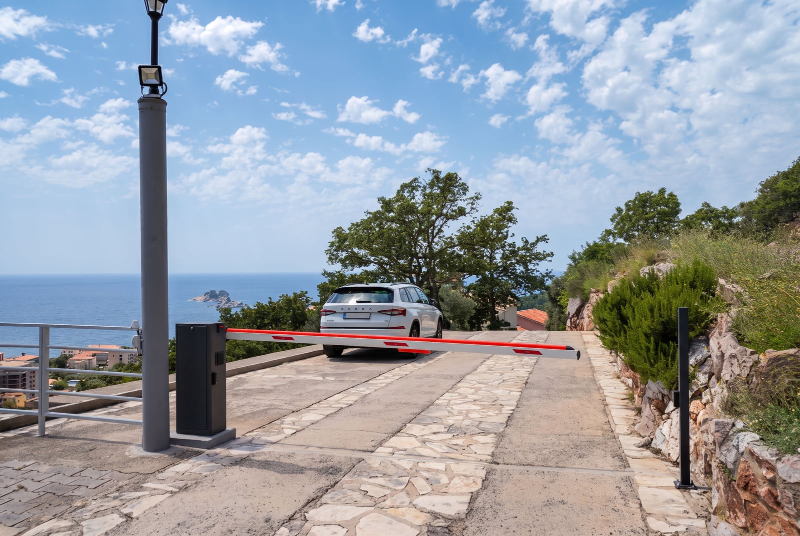 Automatic barrier at the entrance to a gated residential complex in Petrovac, Montenegro.
