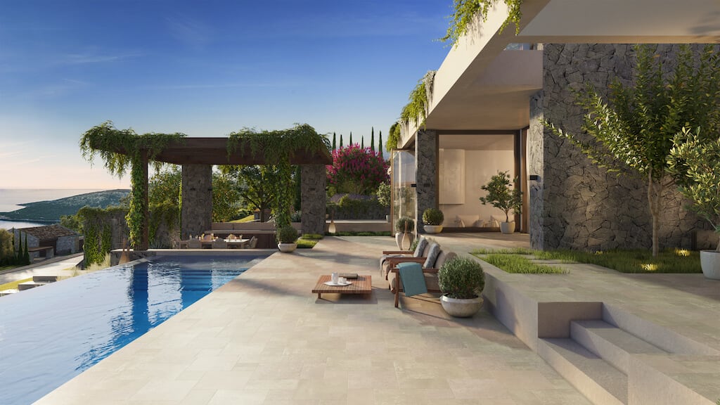 Modern villa with an infinity pool, terrace, and sea view in Luštica, Montenegro. Stone facade finishing.