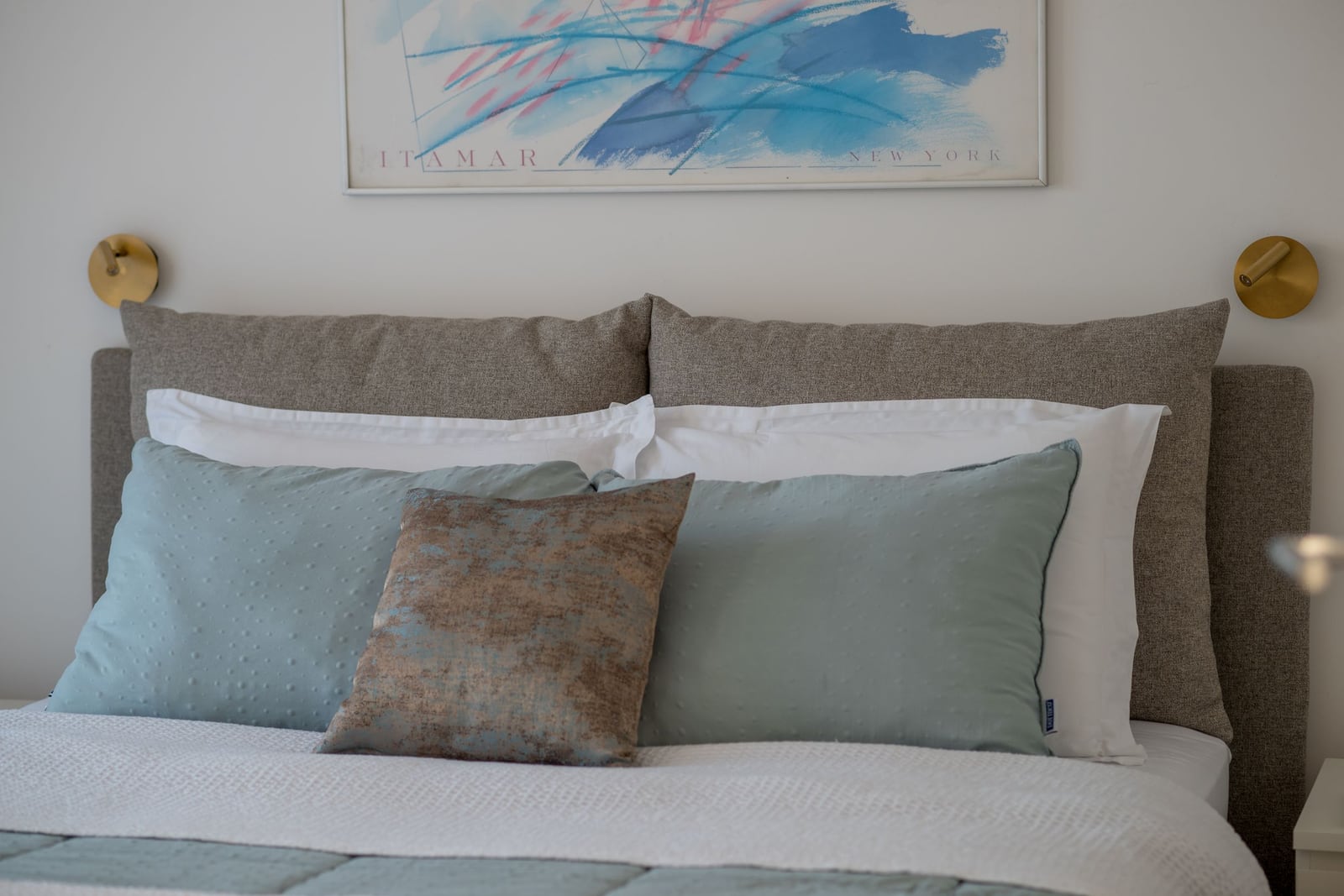 Cozy bedroom in an apartment in Tivat, Montenegro: double bed with a soft headboard and stylish decor.