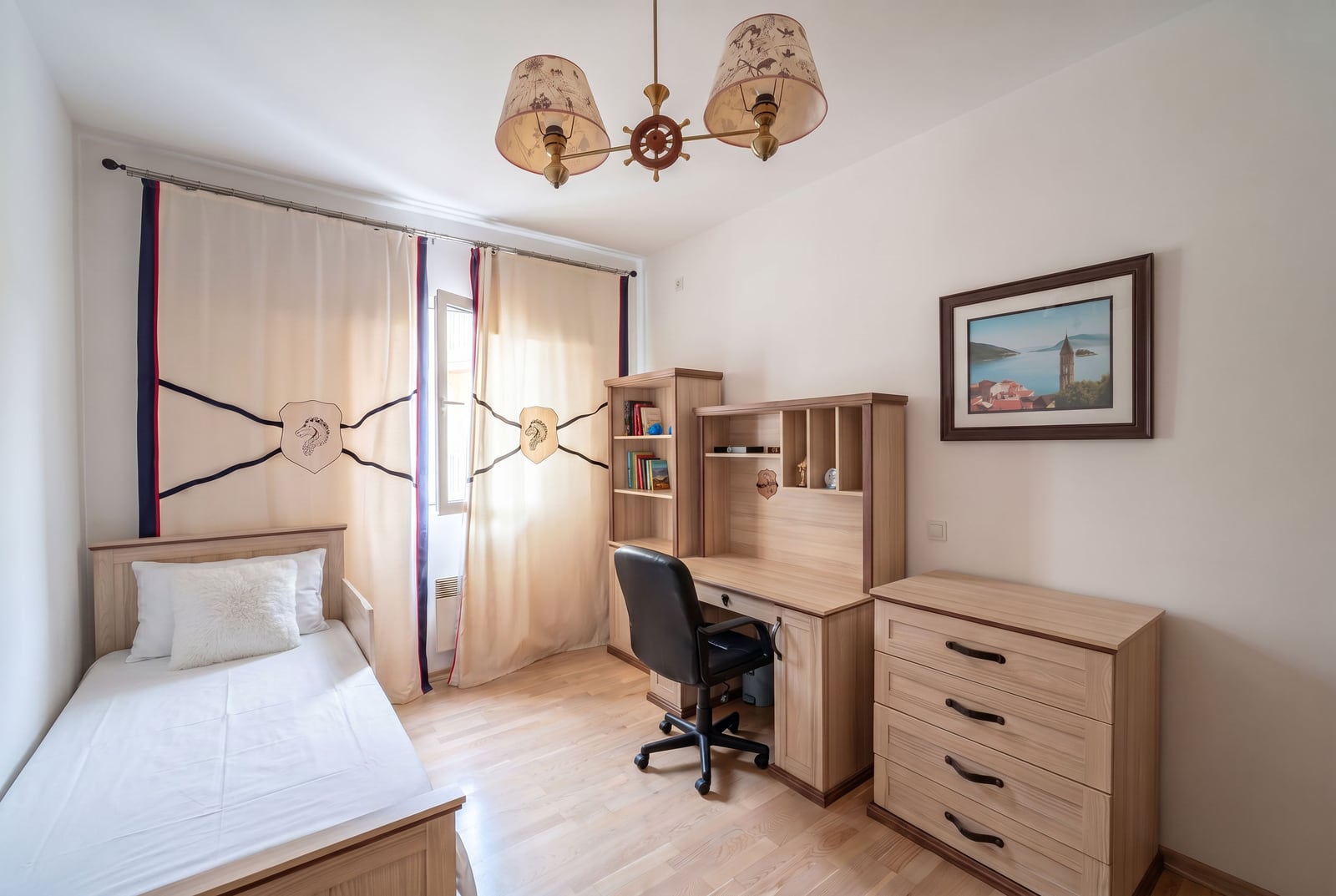 Children's bedroom with wooden furniture and nautical decor in an apartment, Kumbor, Montenegro.