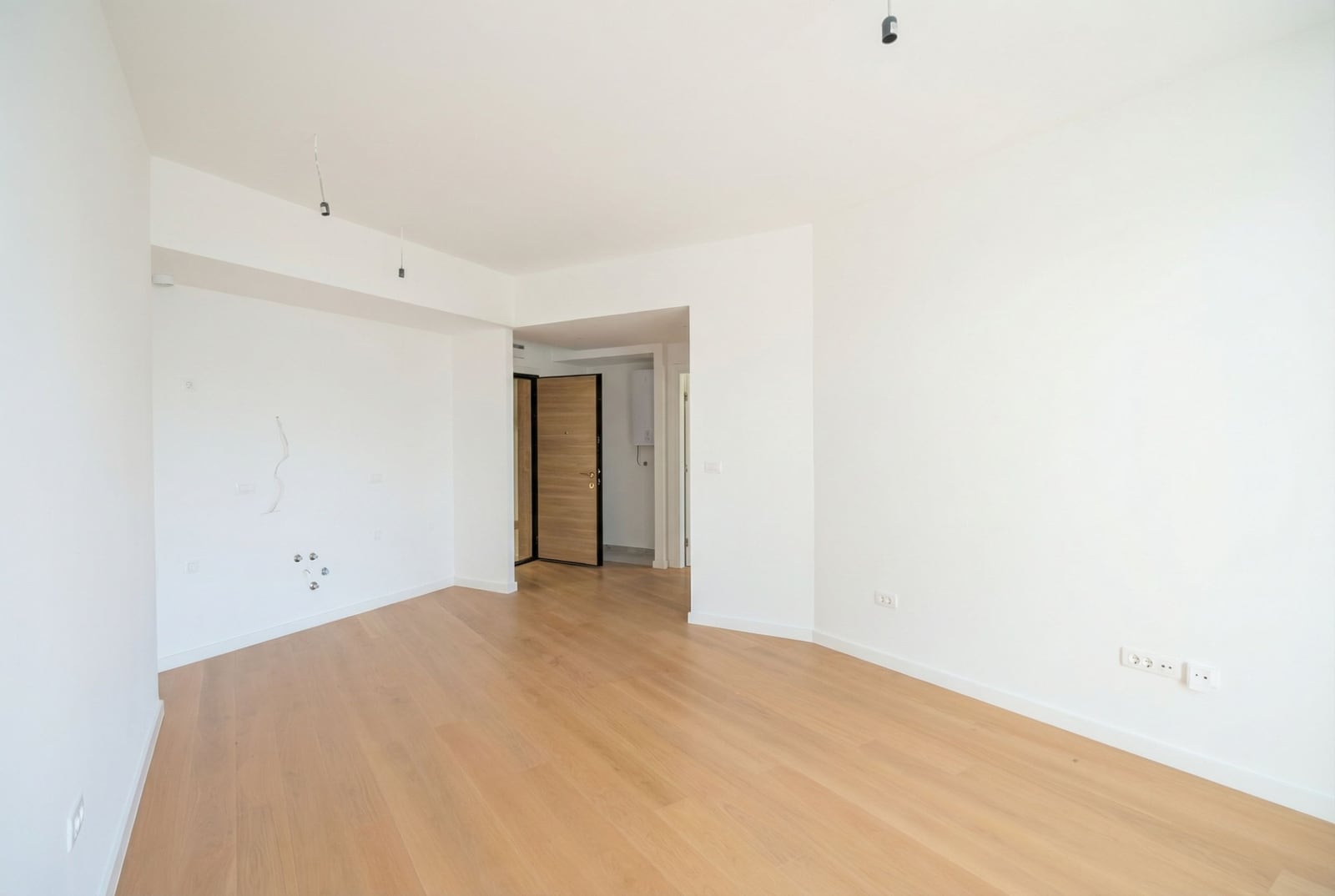 Bright living room with turnkey finishes and parquet flooring in a new apartment, Becici, Montenegro.