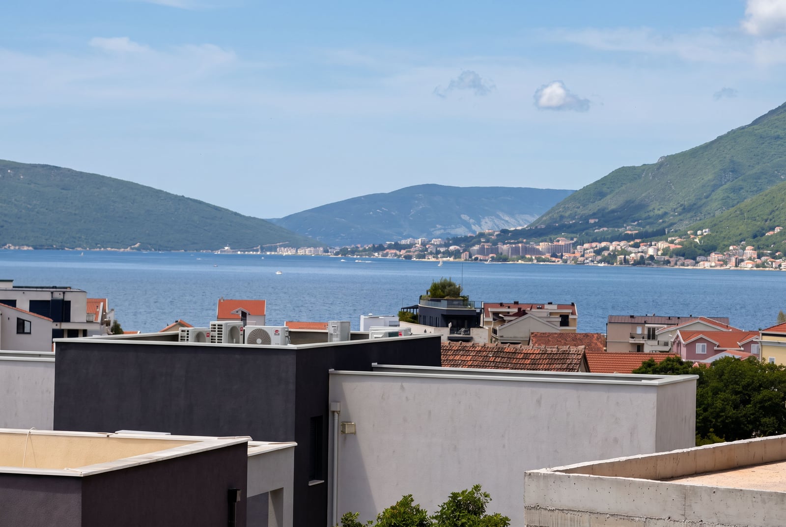 Panoramic view of the sea and mountains from the balcony of an apartment in Tivat, Montenegro.