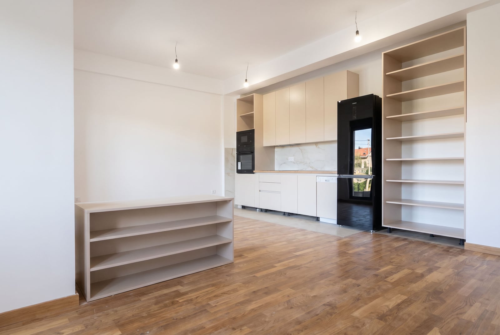New bright kitchen with built-in furniture and appliances in an apartment in the city of Bar, Montenegro