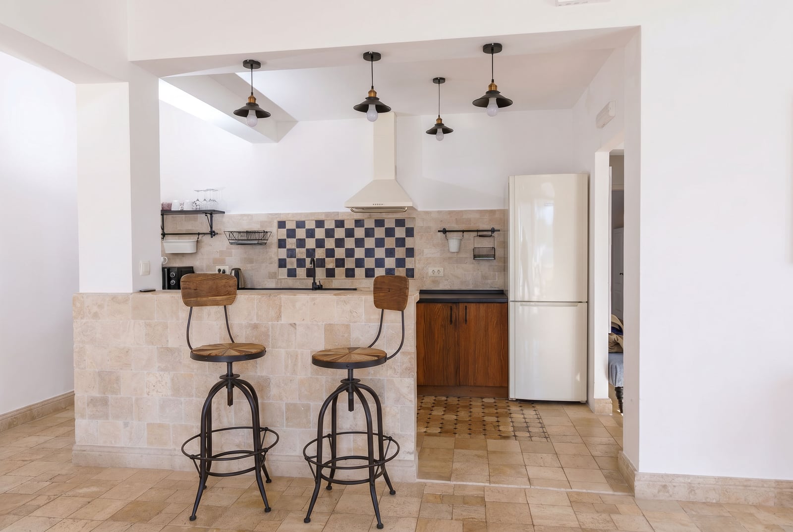 Loft-style kitchen with a bar counter in a penthouse, Risan, Montenegro: modern finishes and cozy interior.