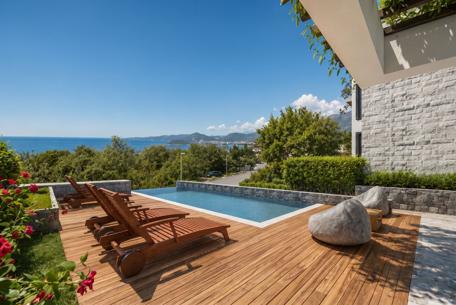 Terrace with a swimming pool and sea view in a townhouse, Blizikuće, Reževići, Montenegro: wooden decking and sun loungers.