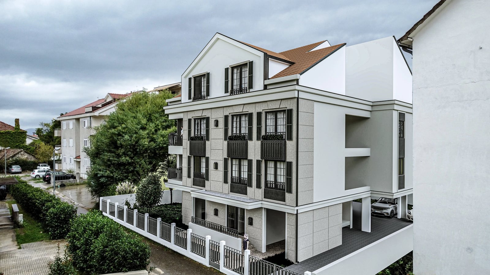 Modern residential building with terraces and parking in Tivat, Montenegro: street view of the building facade.