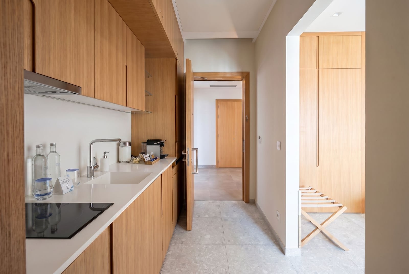 Modern kitchen with wooden furniture in a Lustica Bay apartment, Lustica, Montenegro.