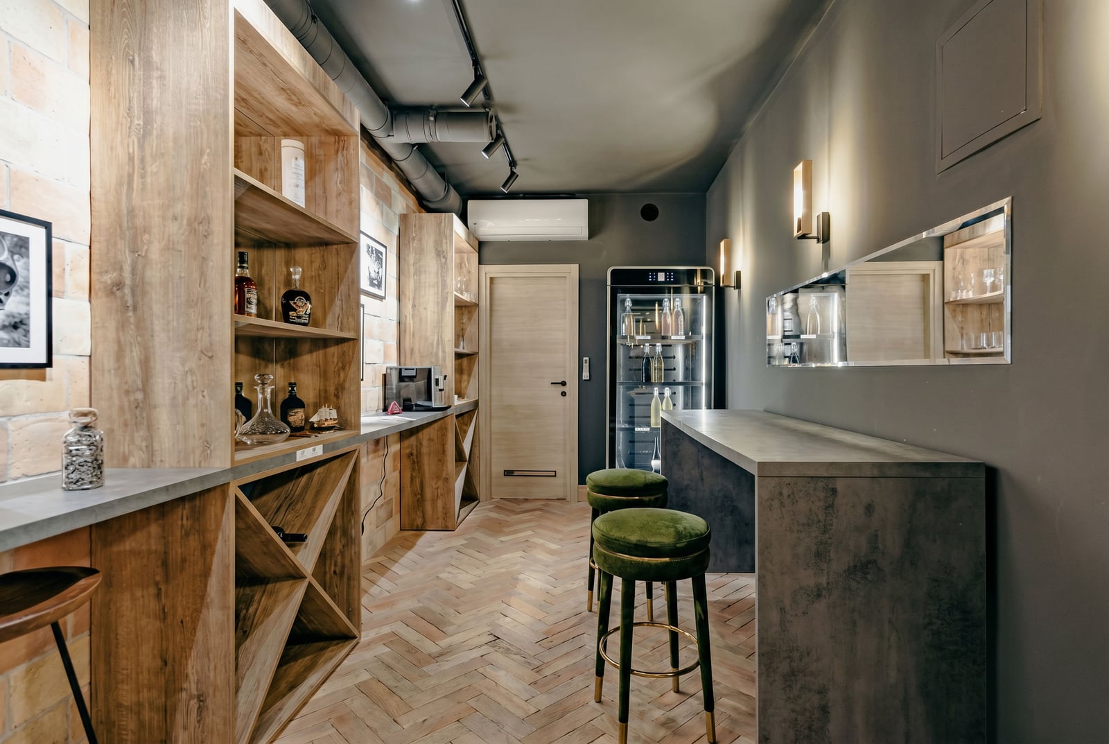 Stylish bar area with a wine cooler and wooden shelving in a luxury villa, Kumbor, Montenegro.