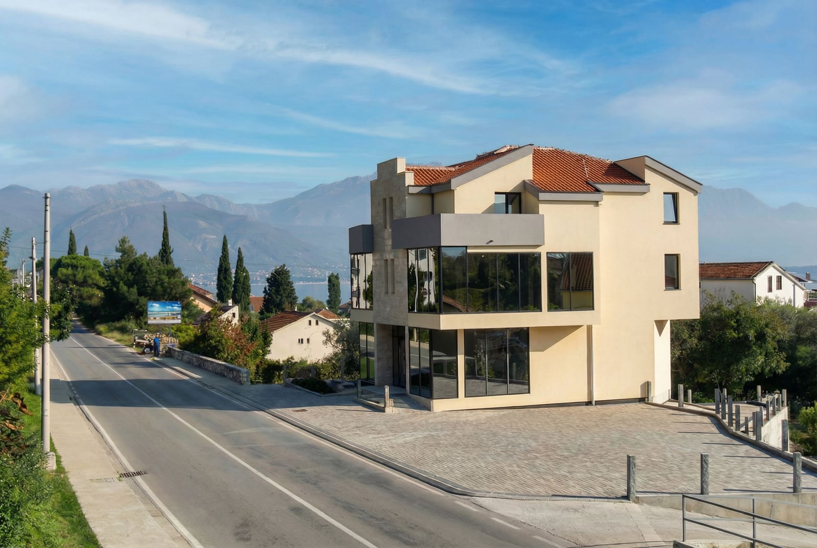 Modern office building with panoramic windows in Baošići, Herceg Novi, Montenegro, mountain and sea view.