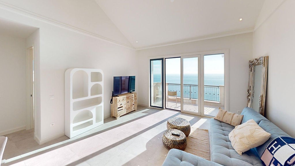 Bright living room in Luštica Bay apartments, Montenegro: panoramic sea view, stylish furniture, and terrace.